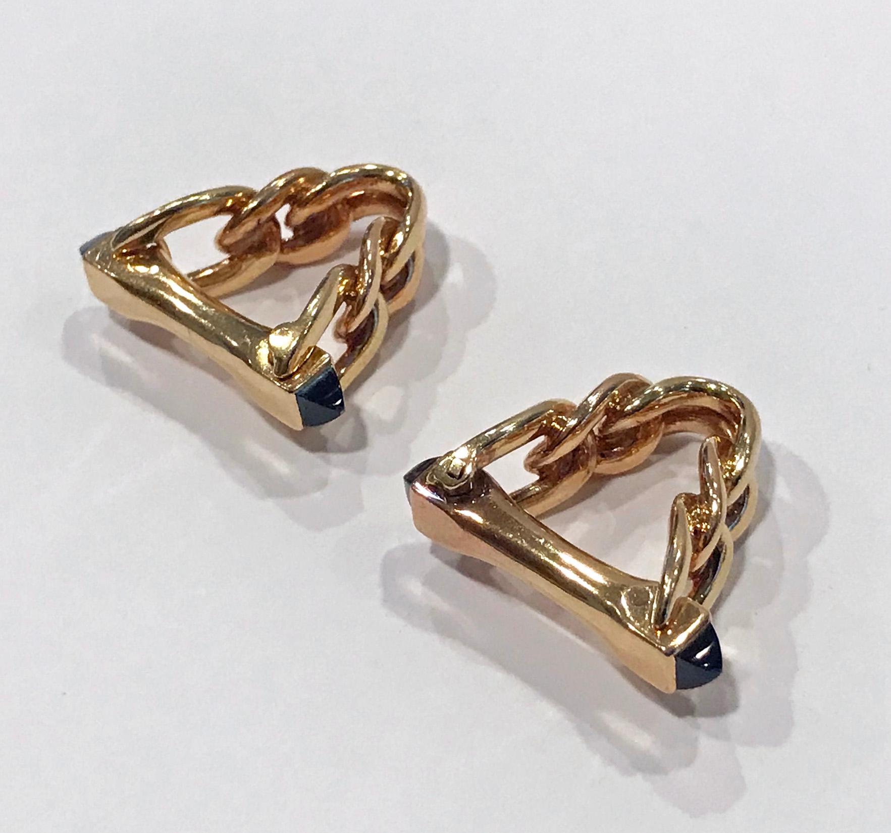 French 1970's 18K Cufflinks. Stirrup like hinged design each set with two pyramid shaped sapphires, total sapphire weight approximately 1.00 ct. French Eagle marks, maker's mark within lozenge PM and stamped Brevette SDDG  Measure approximately 2.50