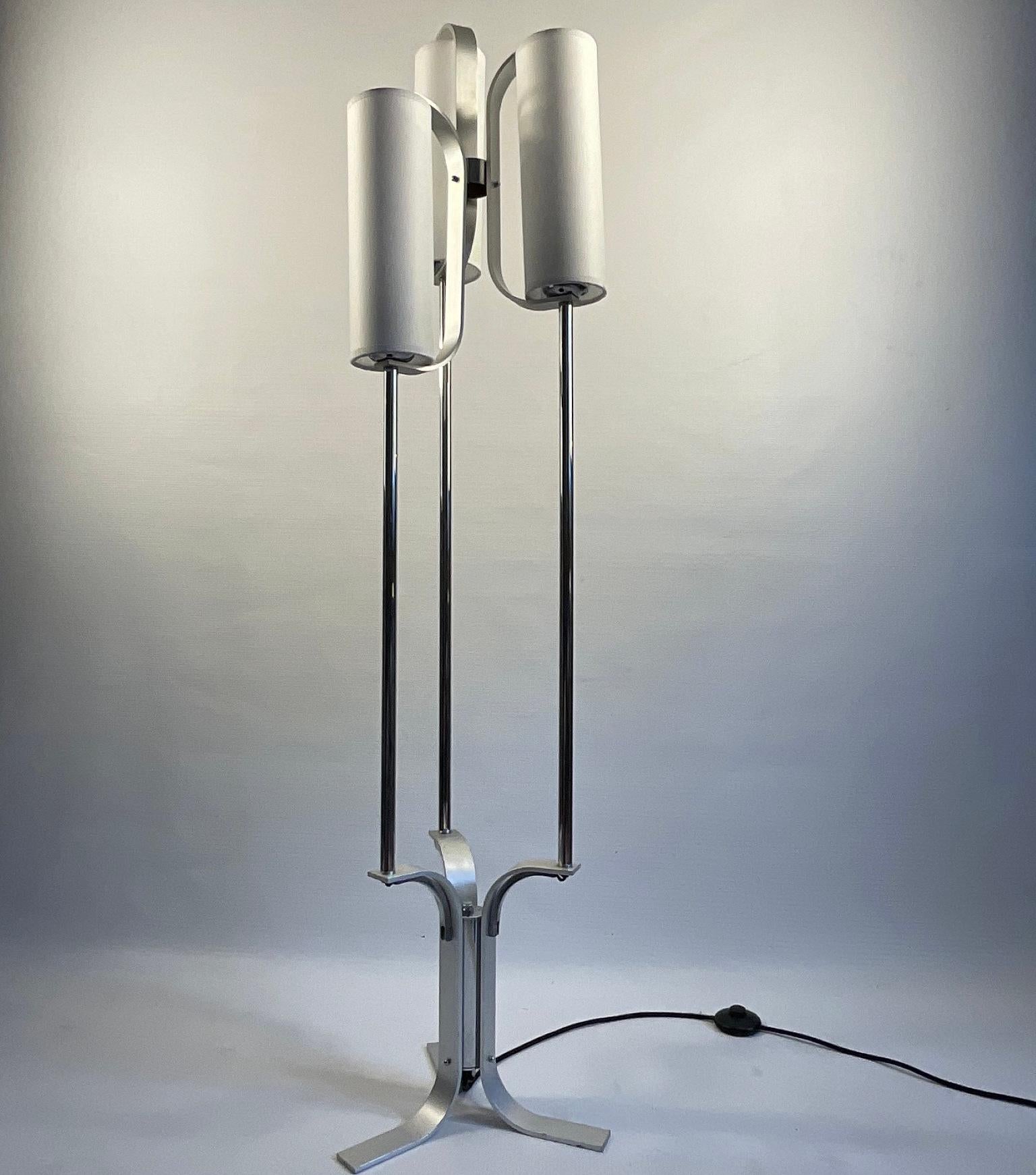 1970s Aluminum floor lamp with four cylindrical parchment lampshades.