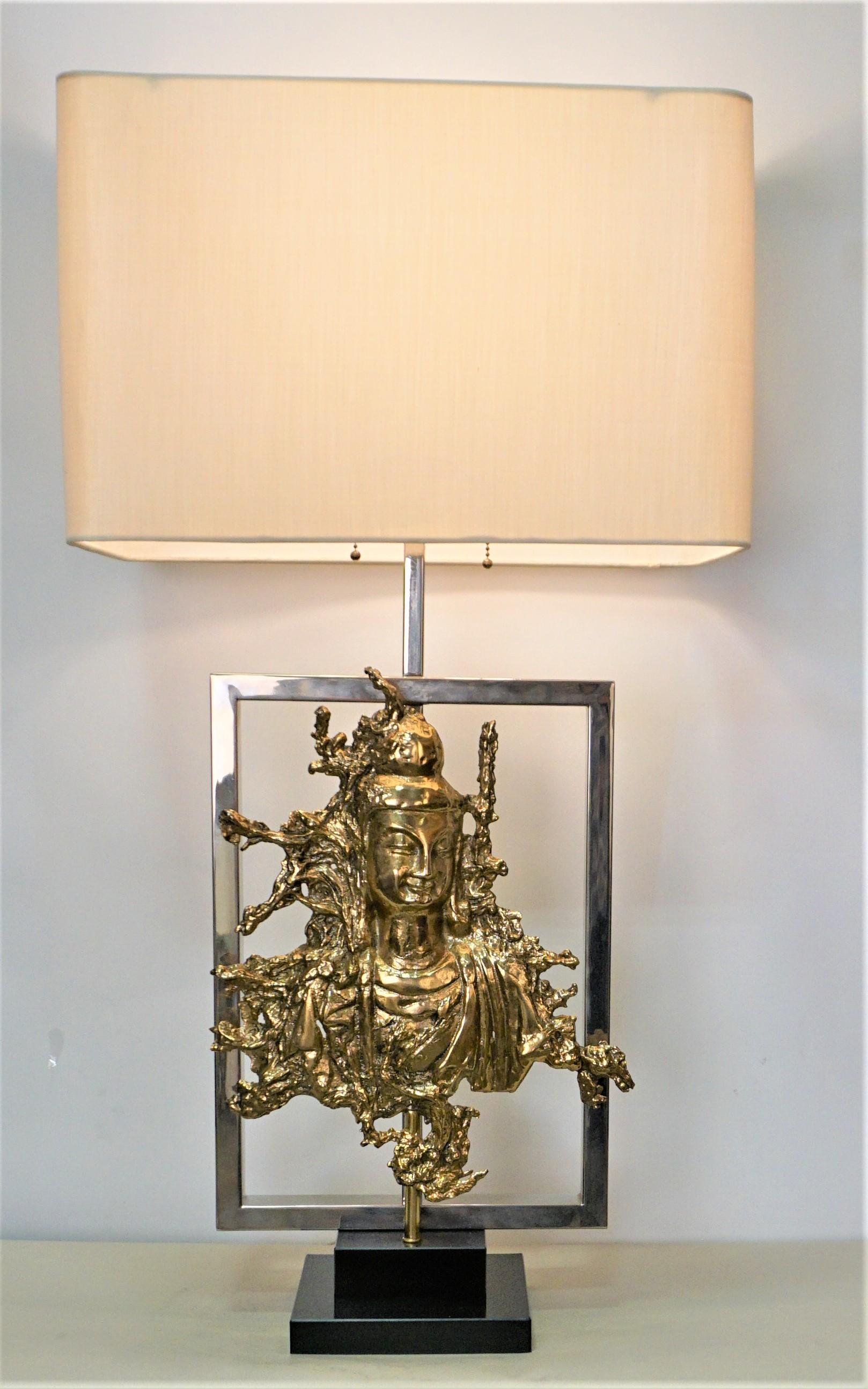 Elegant 1970's bronze sculpture with nickel frame table lamp fitted with oblong silk hardback lampshade.
Measurement include the shade.