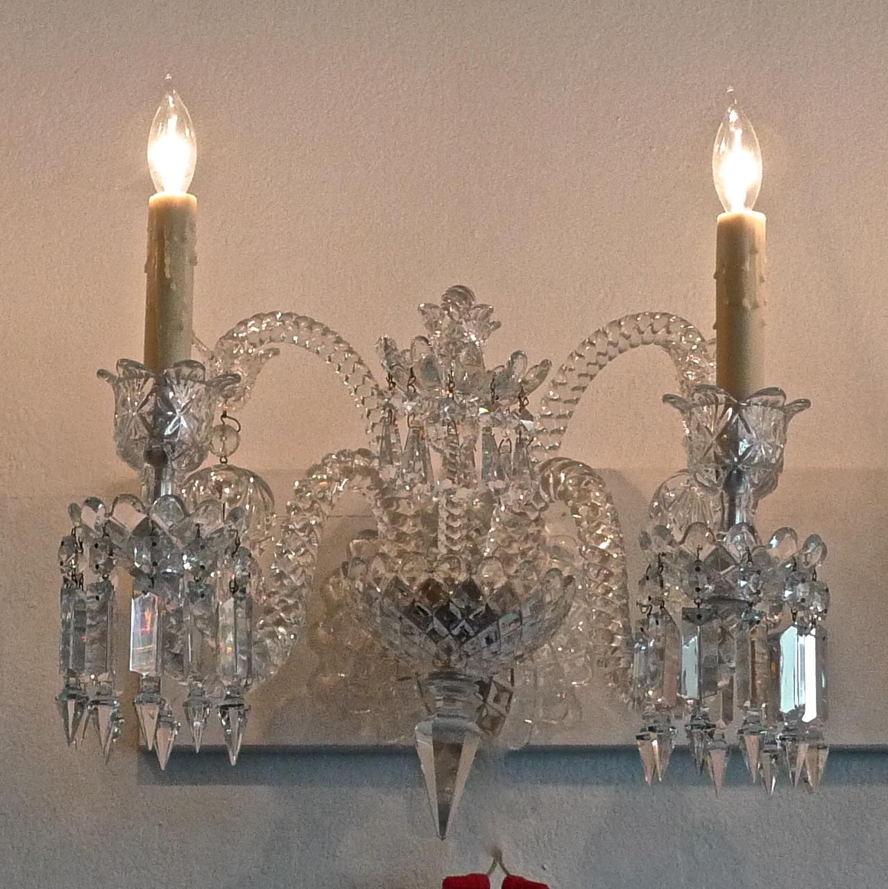 French 1970s diamante Baccarat crystal electrified wall sconce with 2-light. There is a crack in the back plate.
