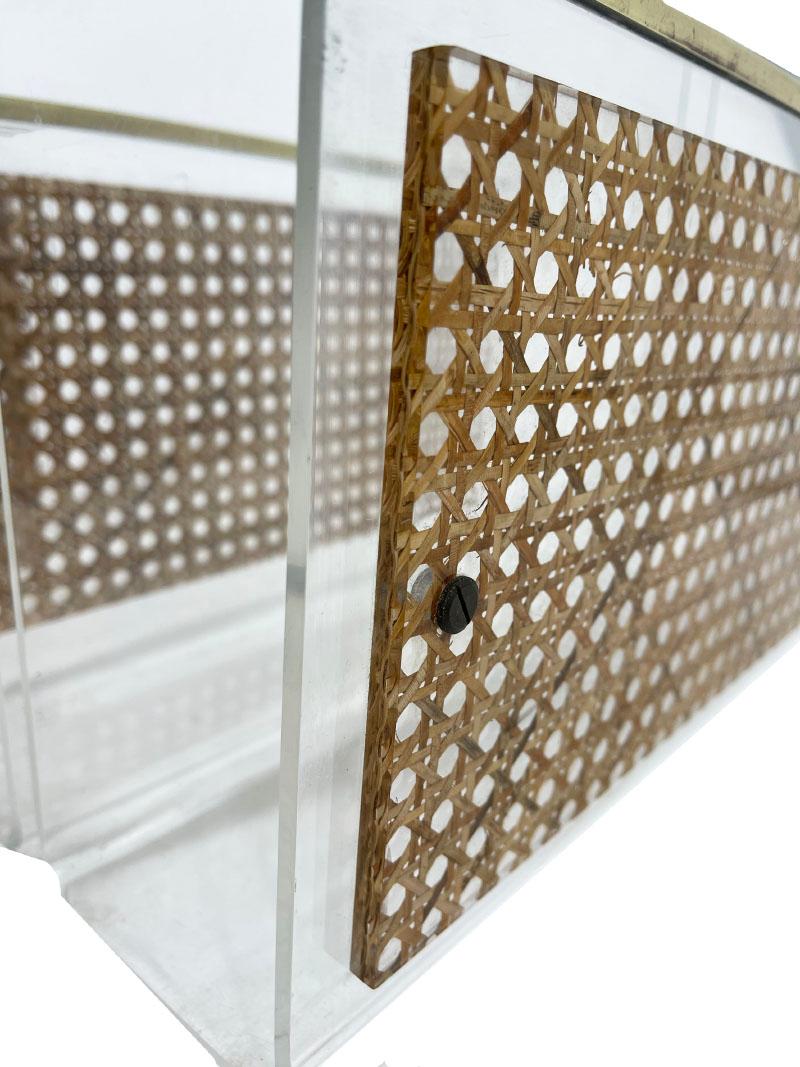 French 1970s Dior Home lucite and cane magazine holders

A French design by Dior Home Collection, 1970s.
Lucite magazine racks or holders with cane 
Woven cane set in lucite in a square plaque. This square lucite with cane is screwed at the