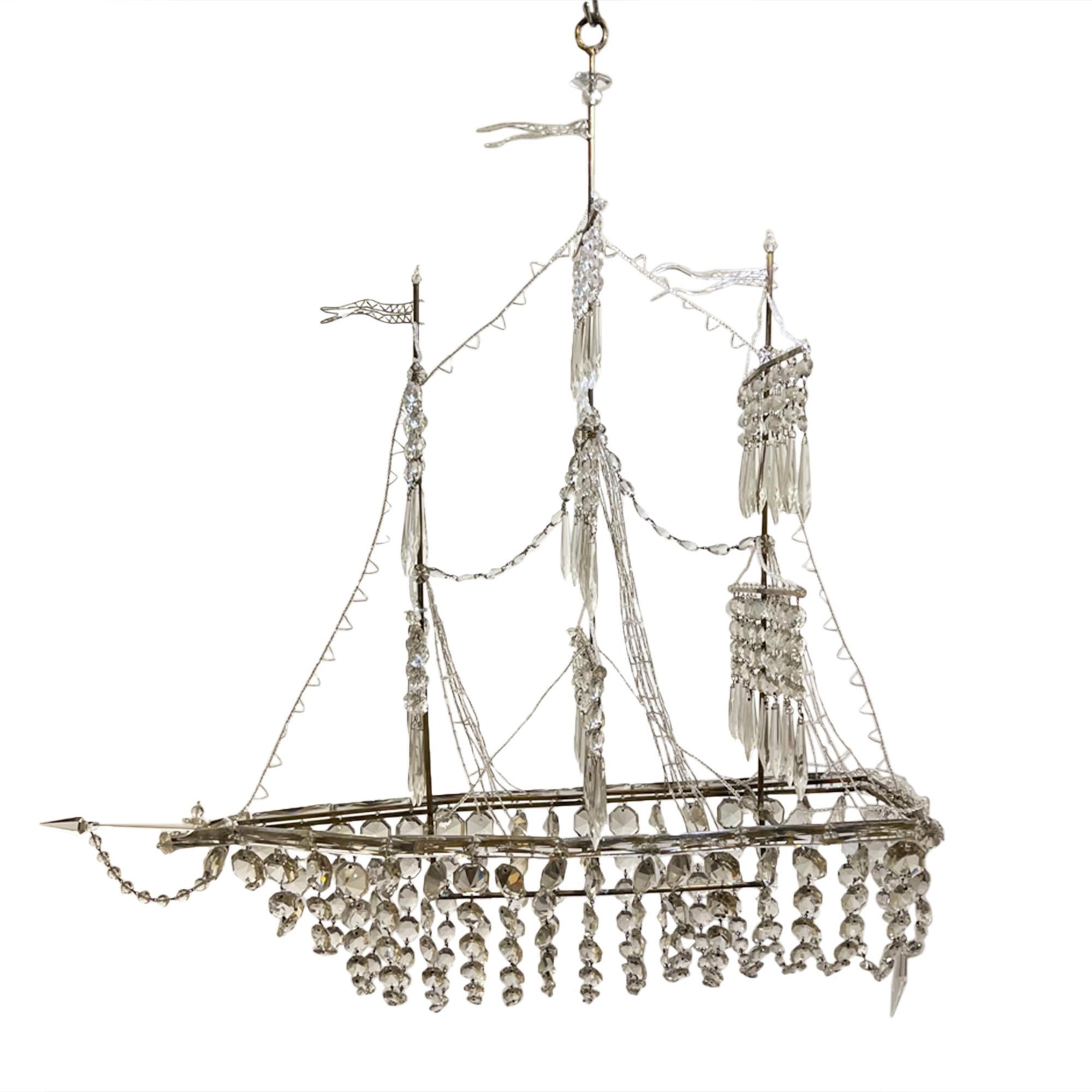 This large fully restored ship chandelier was made in France in the 1970s. We particularly like the meticulous attention to detail - scroll through the pictures to see the anchor and the lovely rigging and flags.

Stunning!