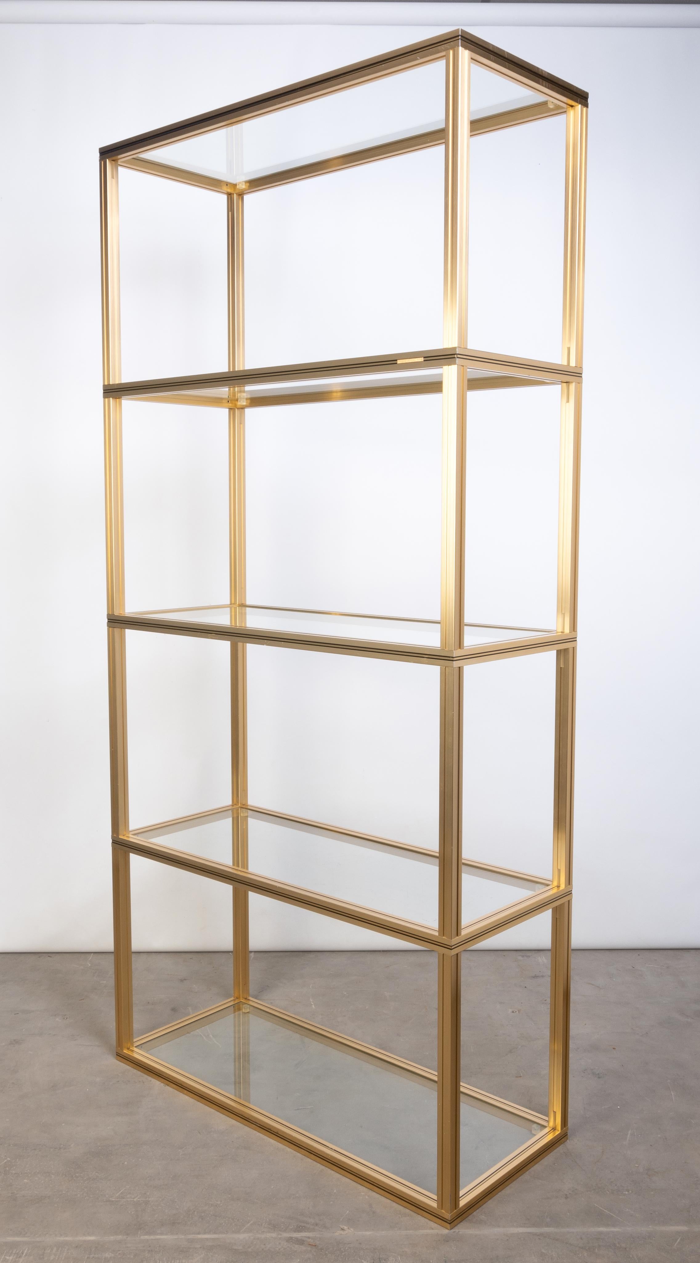 French 1970s Glass & Gold Lacquer Etagere Display Shelving, Pierre Vandel, Paris
Aluminium frame in gold finish, with makers badge.


Height between shelves: 44cm

Condition: Very good condition commensurate of age. Two flea bites to one glass shelf
