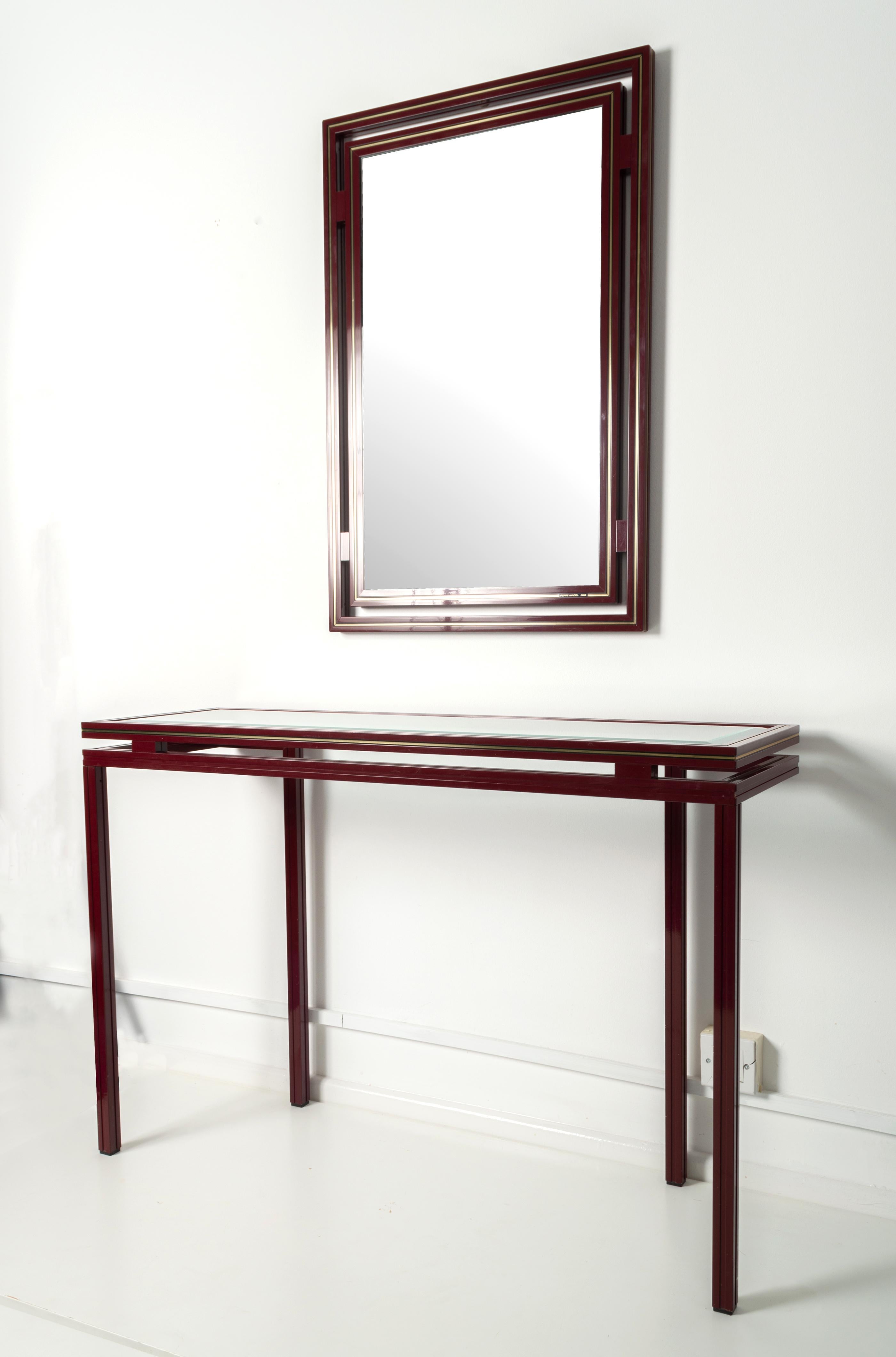 1970s console table and wall mirror by Pierre Vandel, Paris

The rectangular mirror with double striped aluminium lacquered frame in burgundy and gold, signed: 'Pierre Vandel, Paris'.


Mirror;
89cm high x 60cm wide x 3cm