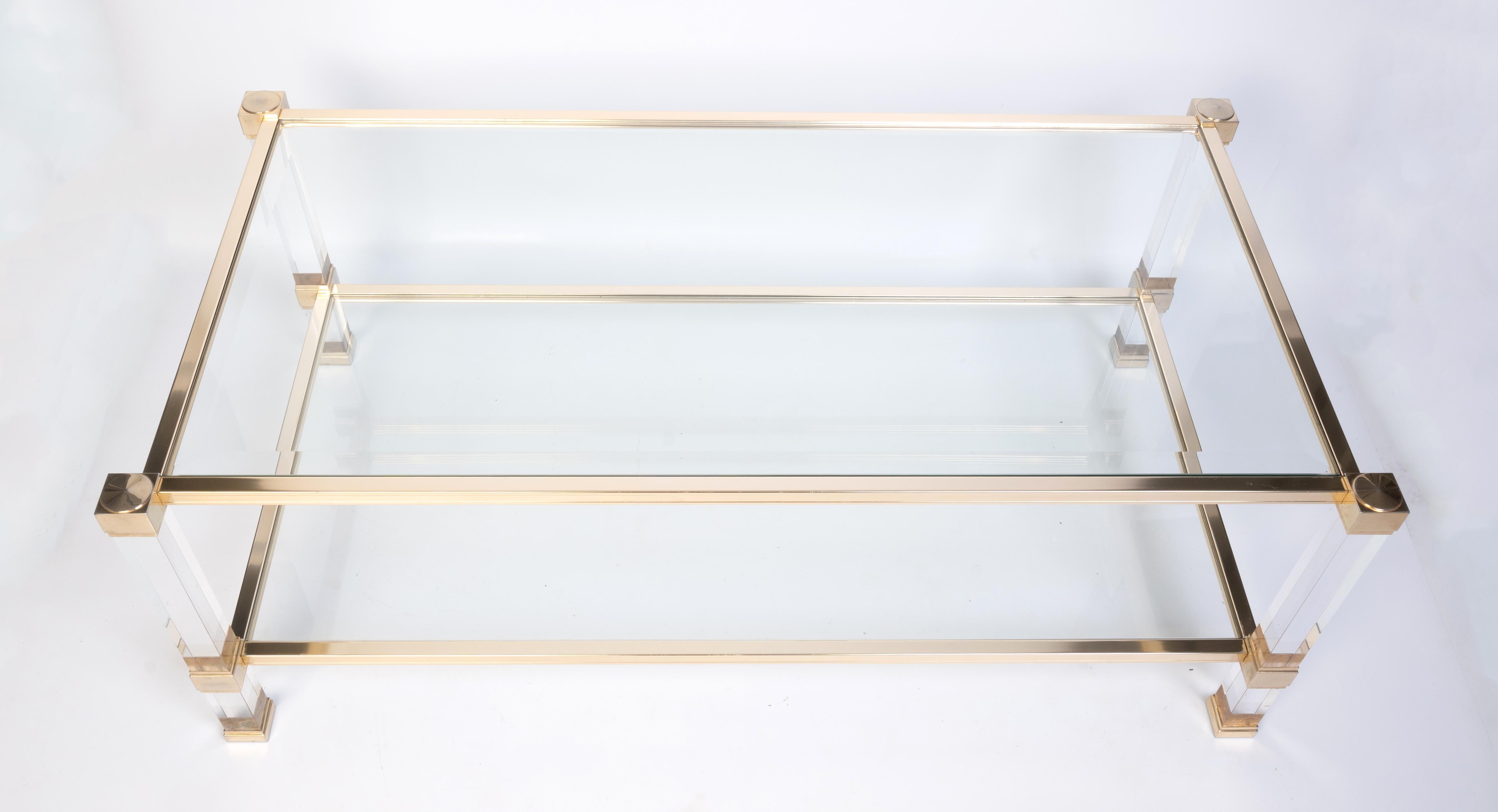 French 1970's Lucite And Lacquered brass two-tier coffee table by Pierre Vandel, Paris

22 Carat gold plated brass.
In very good condition commensurate with age.

Please message for a destination specific shipping quote.