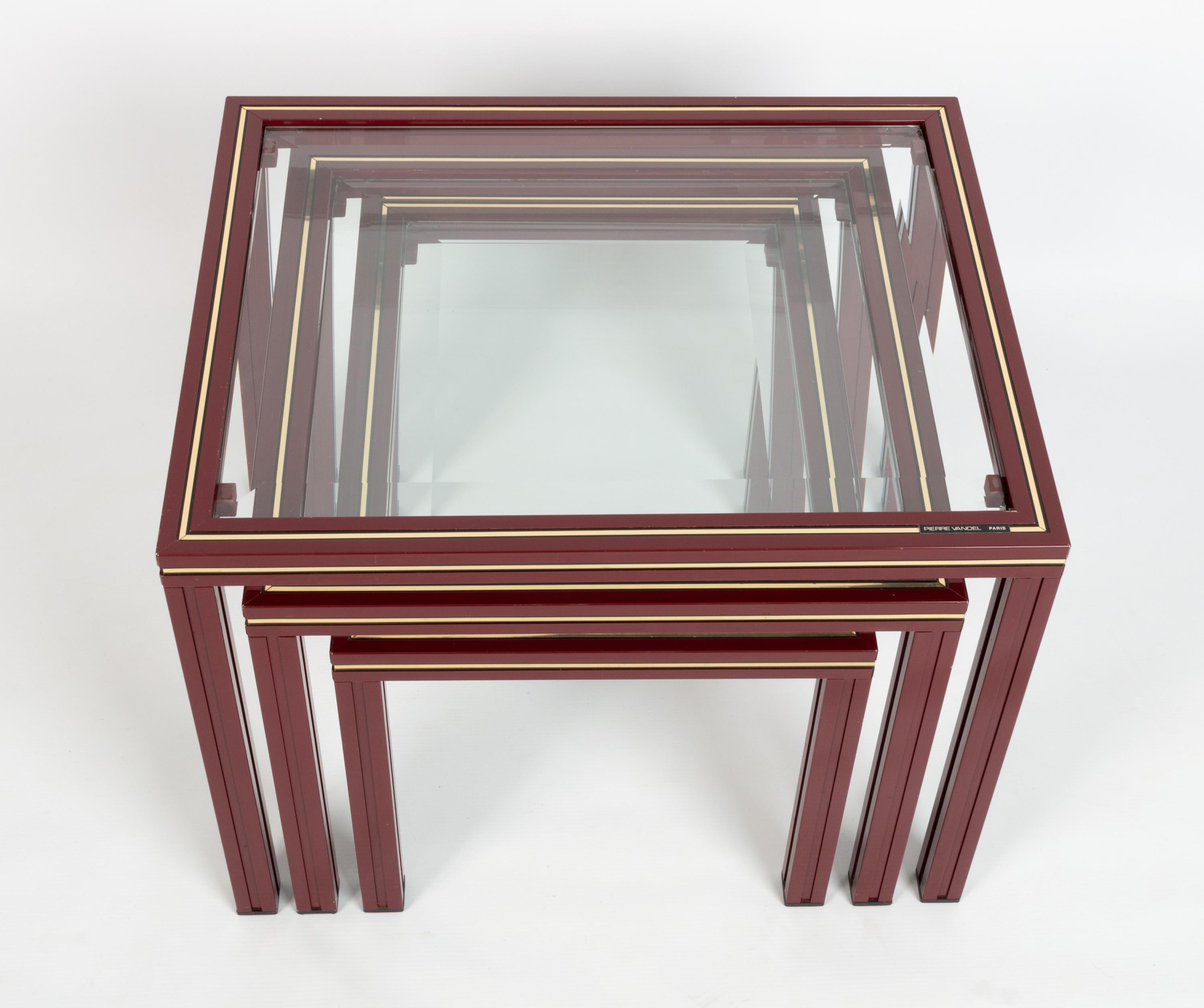 Pierre Vandel set of three nesting tables, France, circa 1970. 

Very good vintage condition, with signs of wear commensurate of age. 

Slight nibbles to glass:
Large table - 2 corners chipped, light scratched to glass
Middle table 1 corner