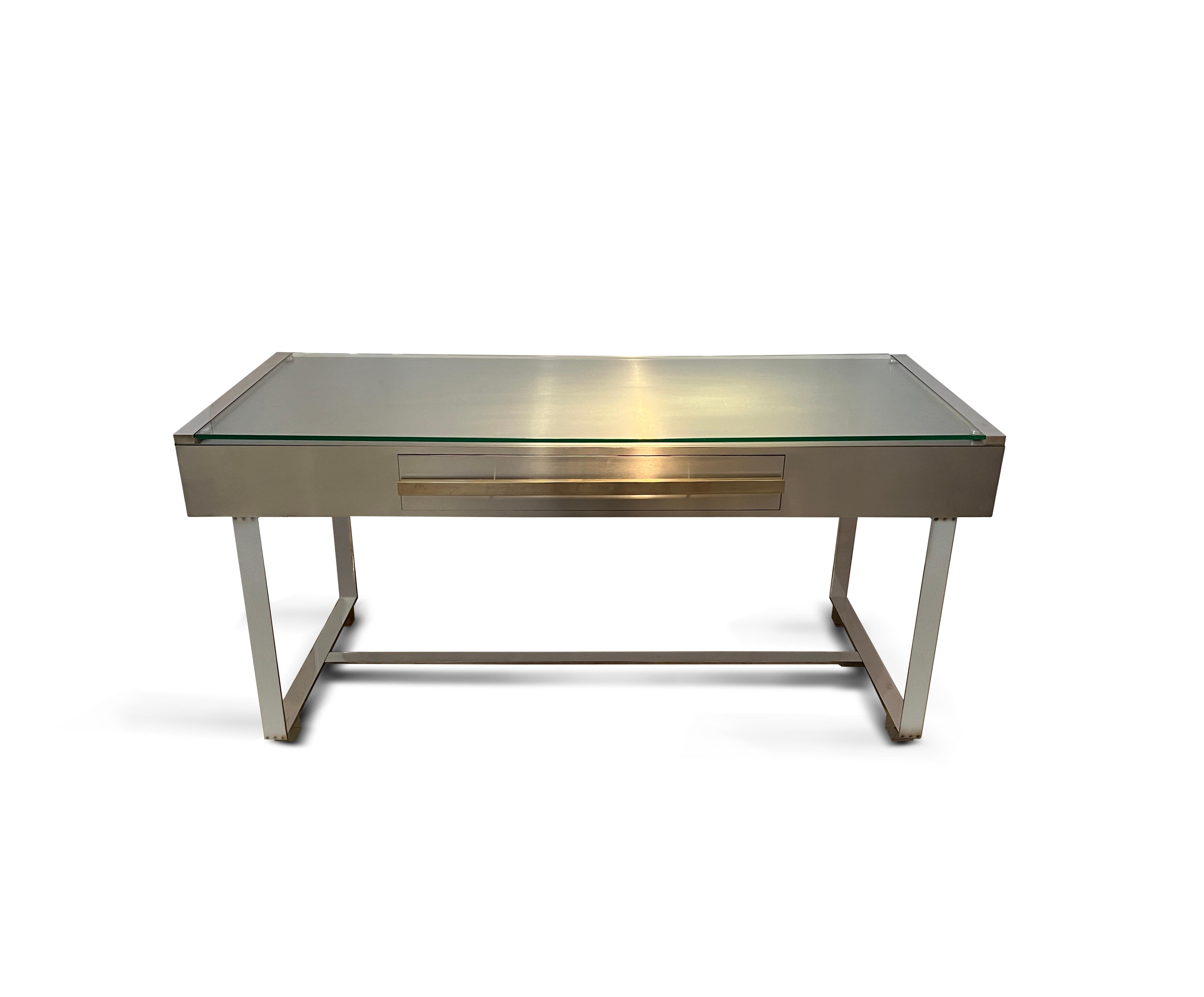 For Cohray
An extremely handsome brushed and polished steel desk with clean lines, the drawer pull with pale, subtle brass finish. Hemispherical steel sections support the 10mm glass top.
Two extending panels left and right ends (each extending a