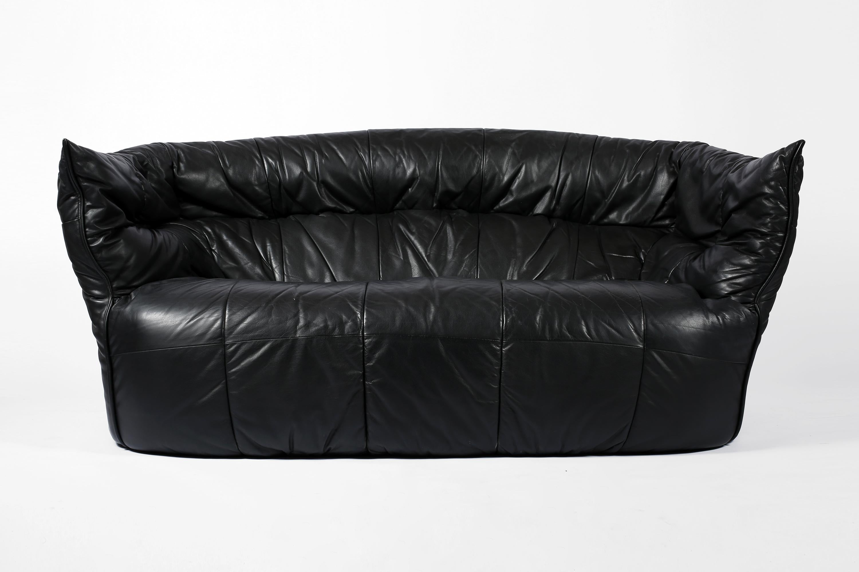 A perfectly patinated black leather two-seater ‘Brigantin’ sofa, designed by Michel Ducaroy for Ligne Roset. French, c. 1980.