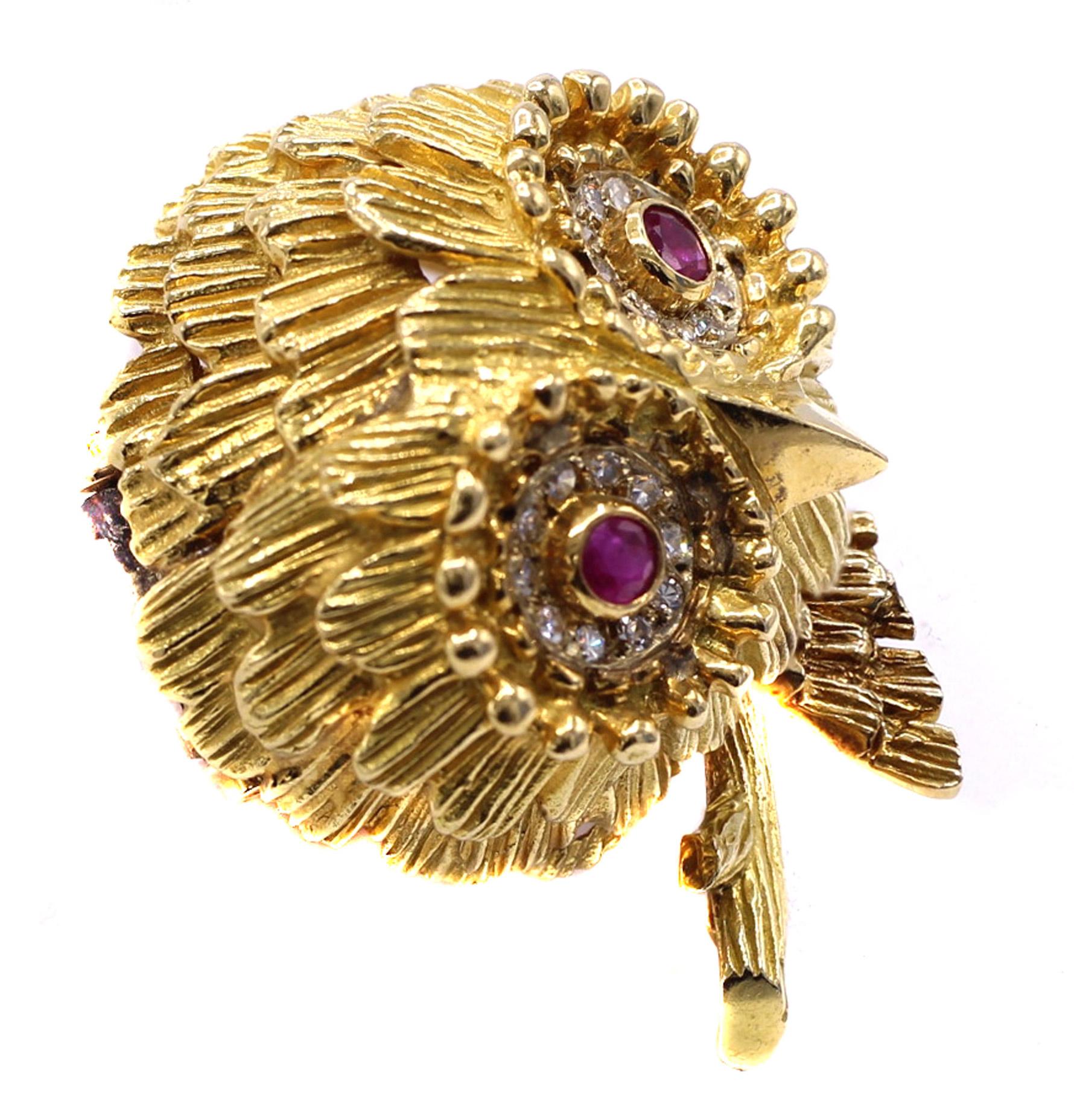Beautifully designed and masterfully handcrafted this whimsical owl brooch is a pure joy to look at. Extremely detailed and worked in 18 karat yellow gold, each section of feathers is finely hand engraved in layers as to create a lifelike and three