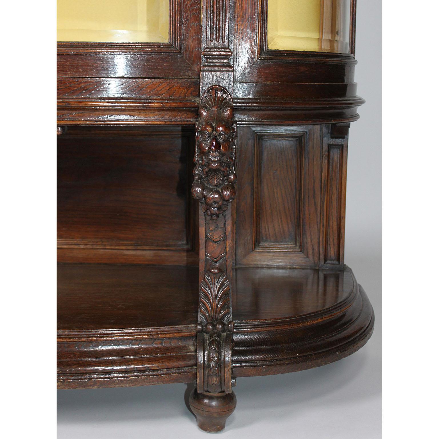 Early 20th Century French 19th-20th Century Baroque Revival Carved Oak Bombé Figural Bombé Vitrine For Sale