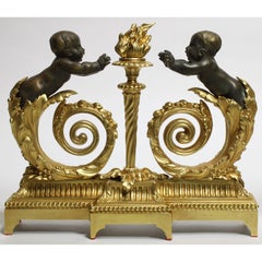 Paire de chenets avec figure d’enfants en bronze doré de style Louis XV ( XIXe - XXe siècles)
