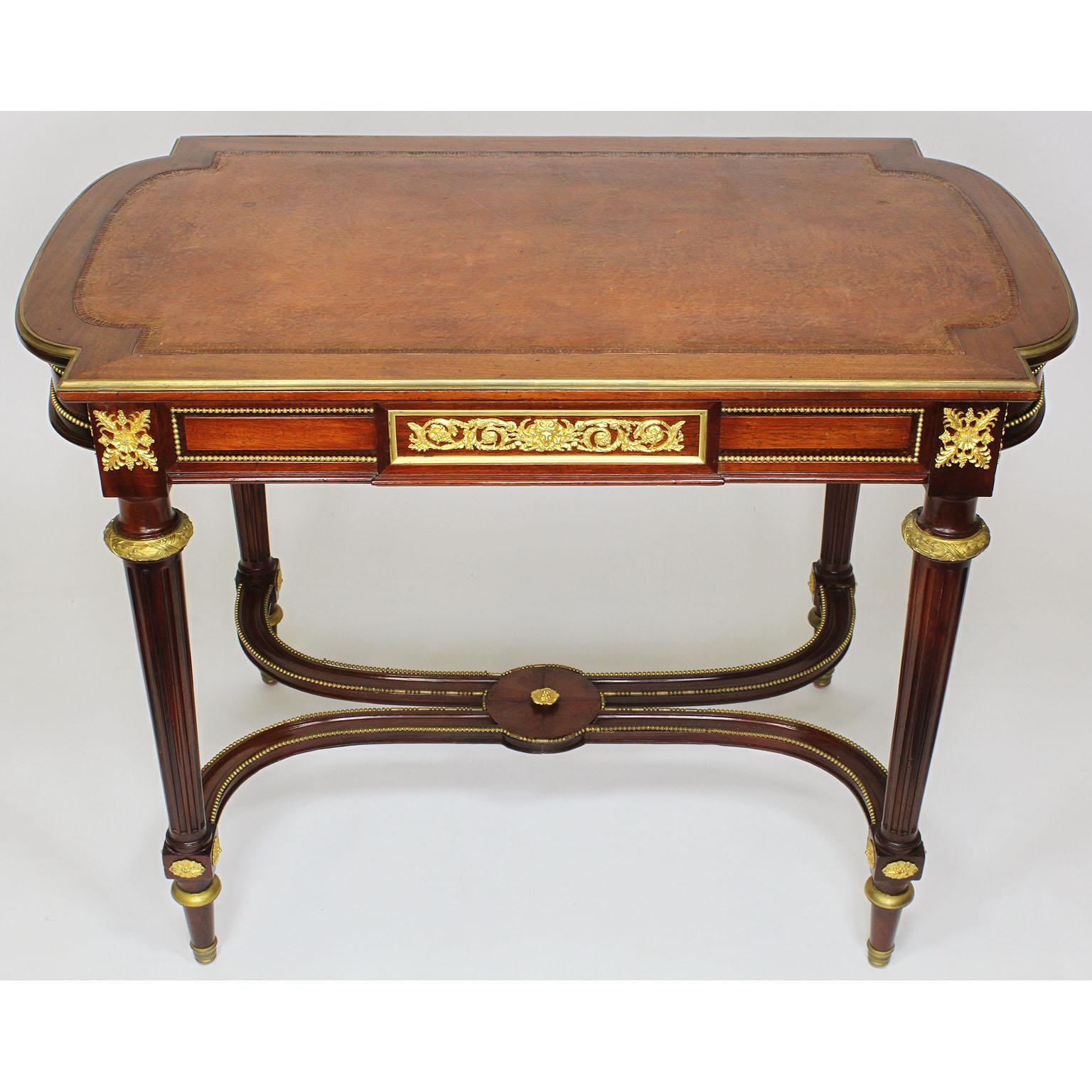 A French 19th-20th century Louis XVI. Mahogany and gilt-bronze mounted centre - Writing table with tooled leather top, Paris, circa 1900.

Measures: Height 29 1/2 inches (74.9 cm)
Width 39 3/4 inches (101 cm)
Depth 23 1/2 inches (59.7 cm).

 