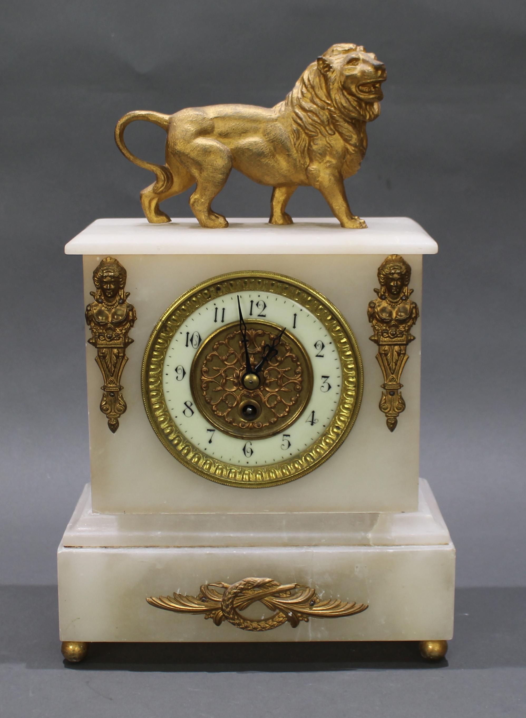 French 19th c. Alabaster Lion mantle clock
 

Period late 19th c., French

Measures: Width 21 cm / 8 1/4 in

Depth 11 cm / 4 1/4 in

Height 33 cm / 13 in

Case & dial Alabaster case with gilt metal adornments and handsome lion to the top.