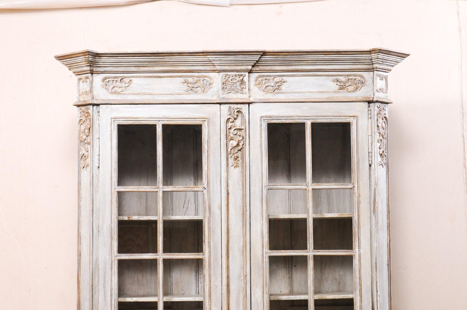 antique wood cabinet with glass doors