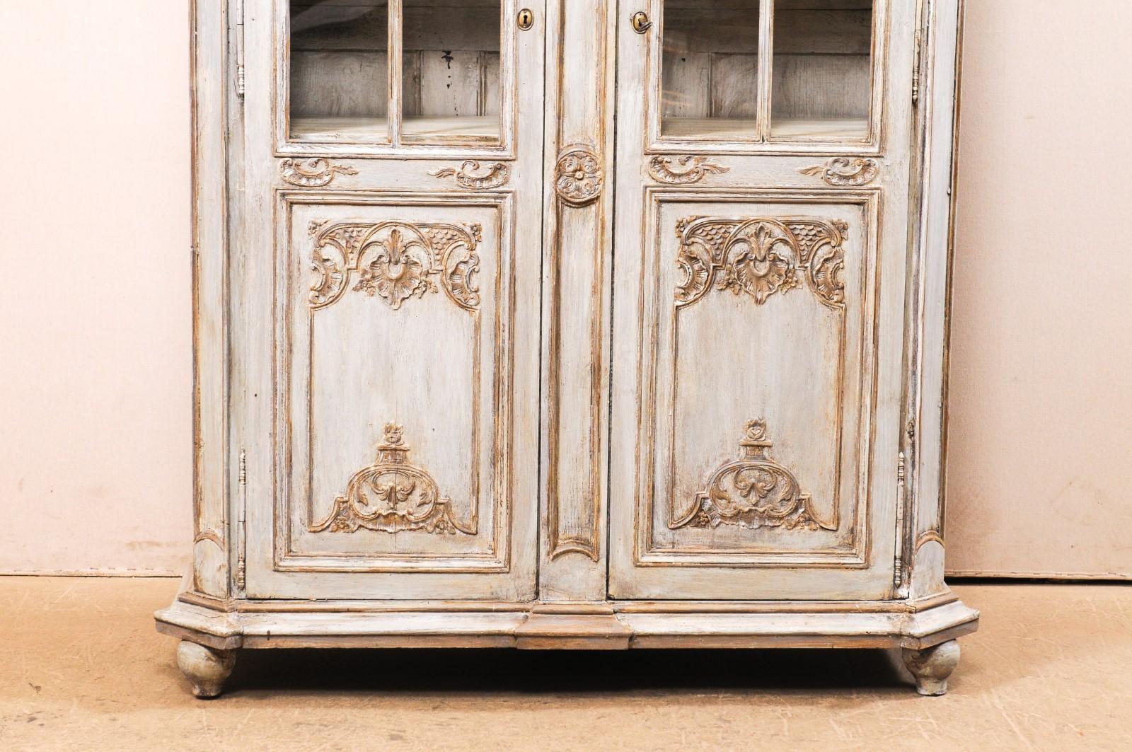 antique wooden cabinet with glass doors