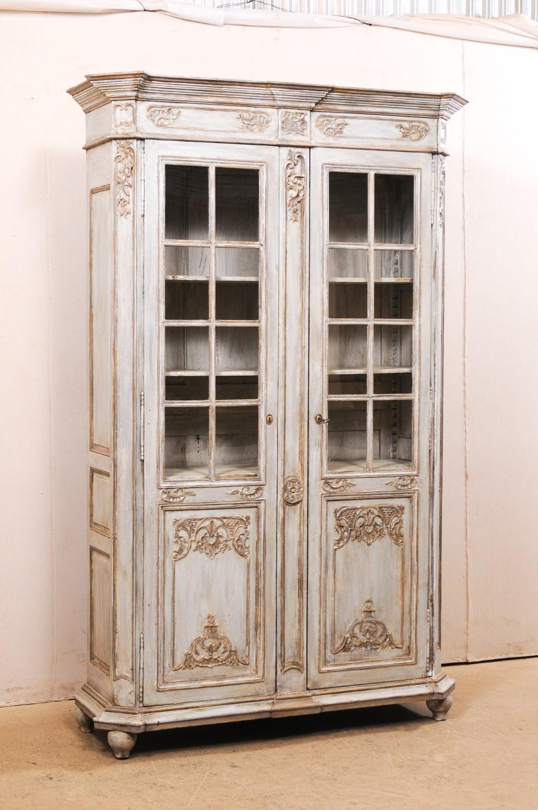 antique wooden cabinet with glass doors