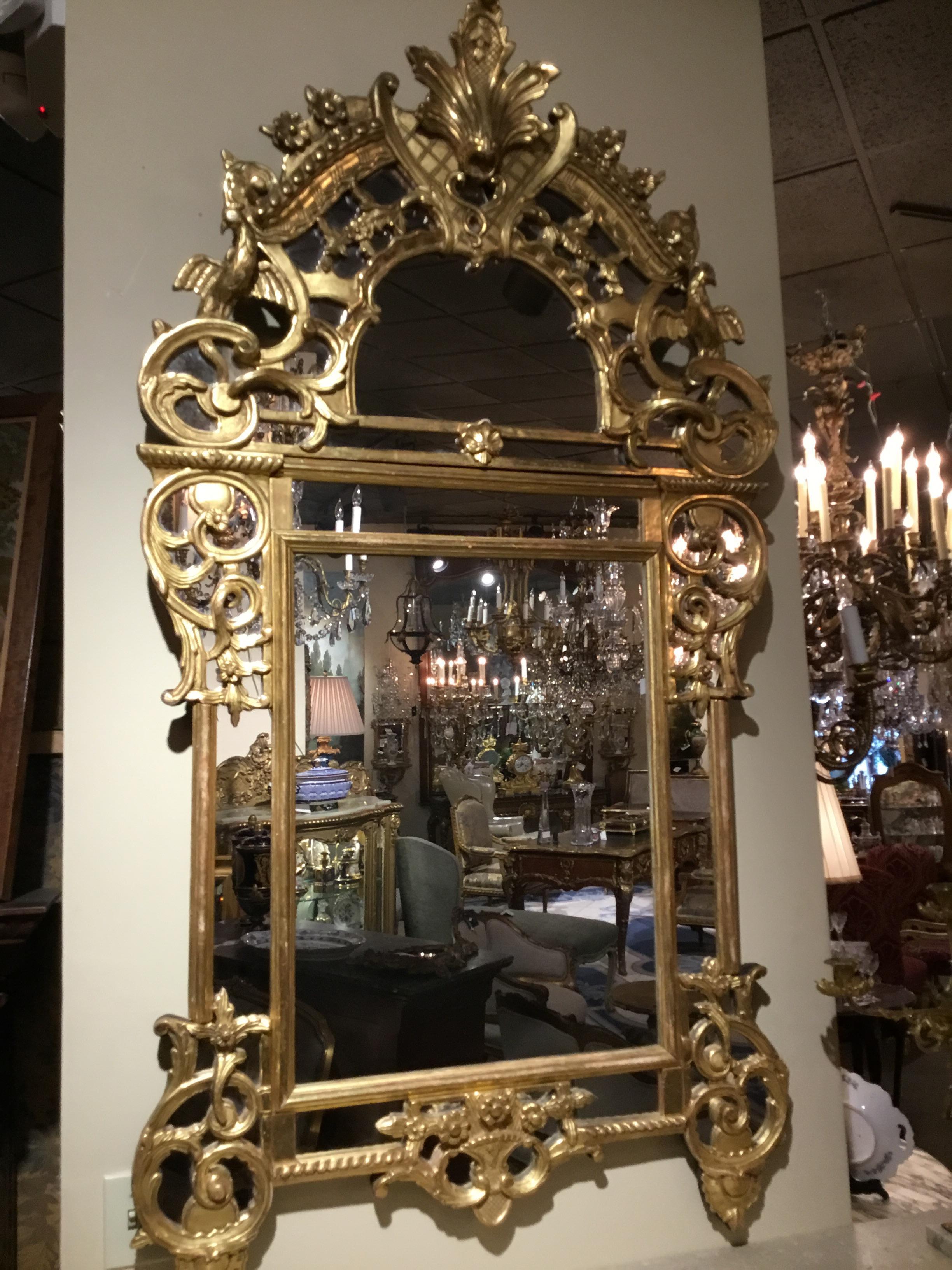 Gilt French 19th c regence  style giltwood reticulated footed mirror