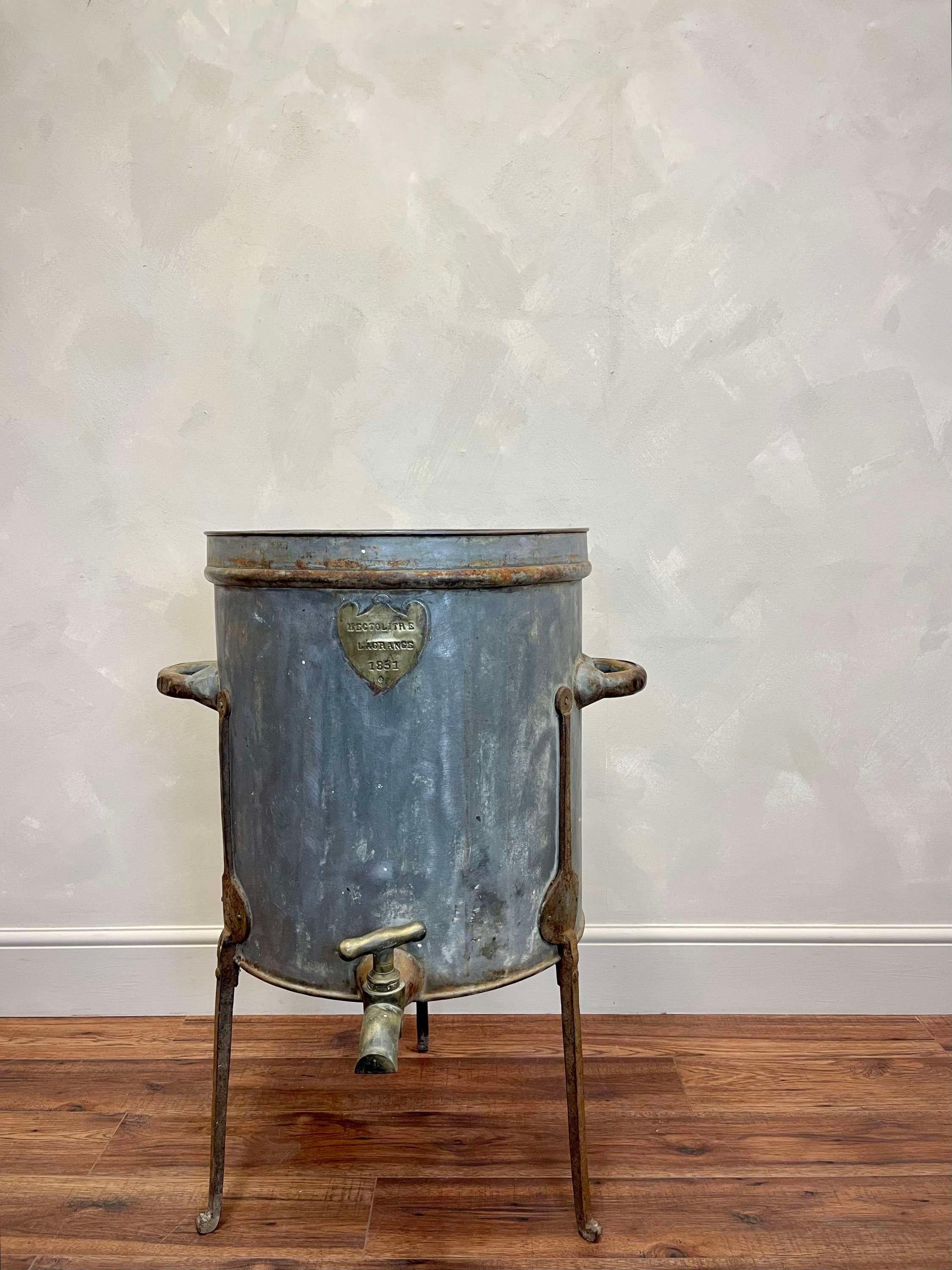 Very decorative, large scale French 19th c Hectolitre. This rare copper and brass wine barrel was used by wineries to measure and pour their wines into bottles, in preparation for consumption or sale.
This example has developed a wonderful patina