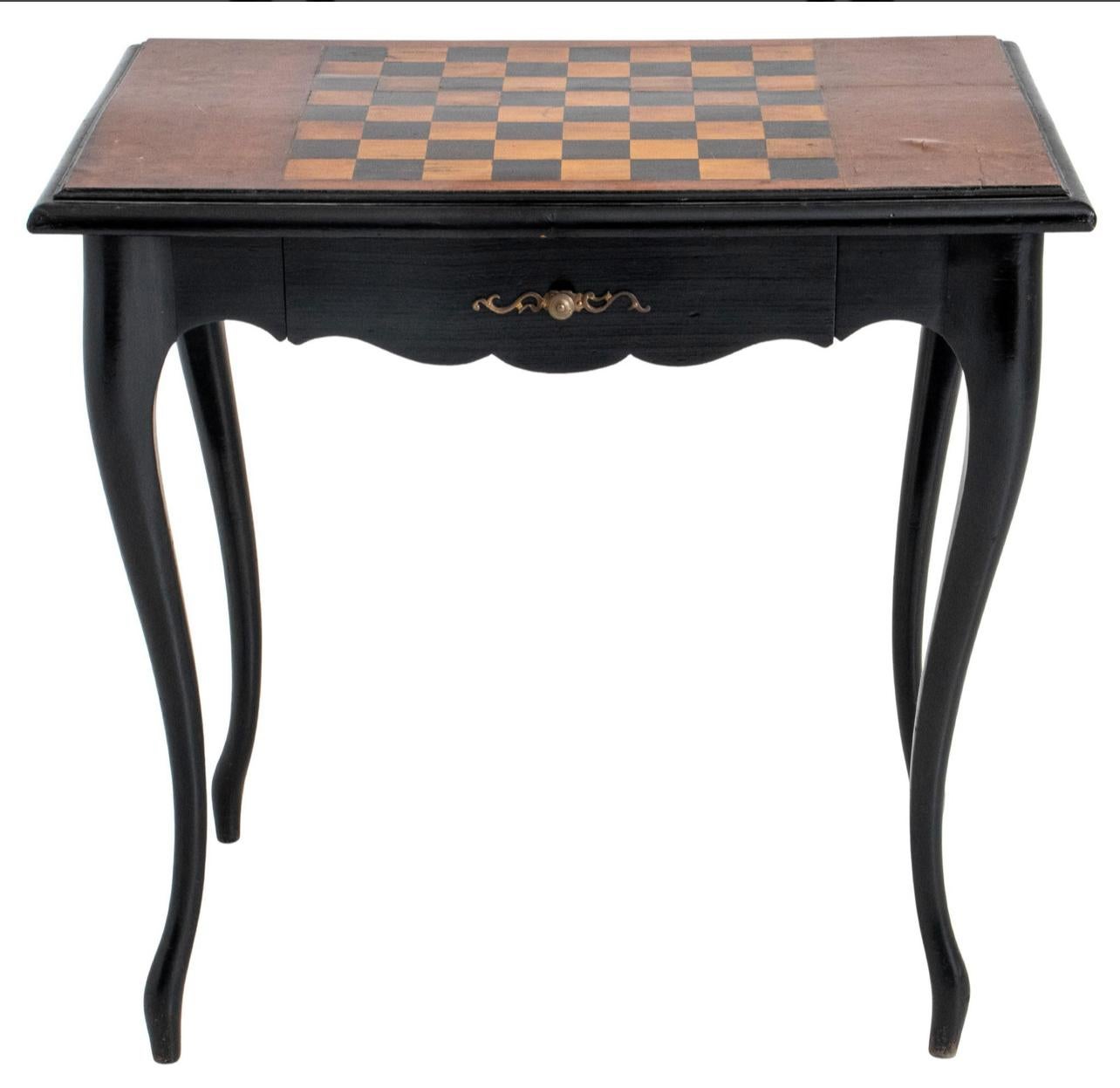 Just in, this is a French Louis XV Style Inlaid and Ebonized Wood Game Table or as we say in French, Table a Jeux.
The top of this charming antique table has an inlaid game board.
One drawer to the front and beautiful and elegant cabriole legs.
Very