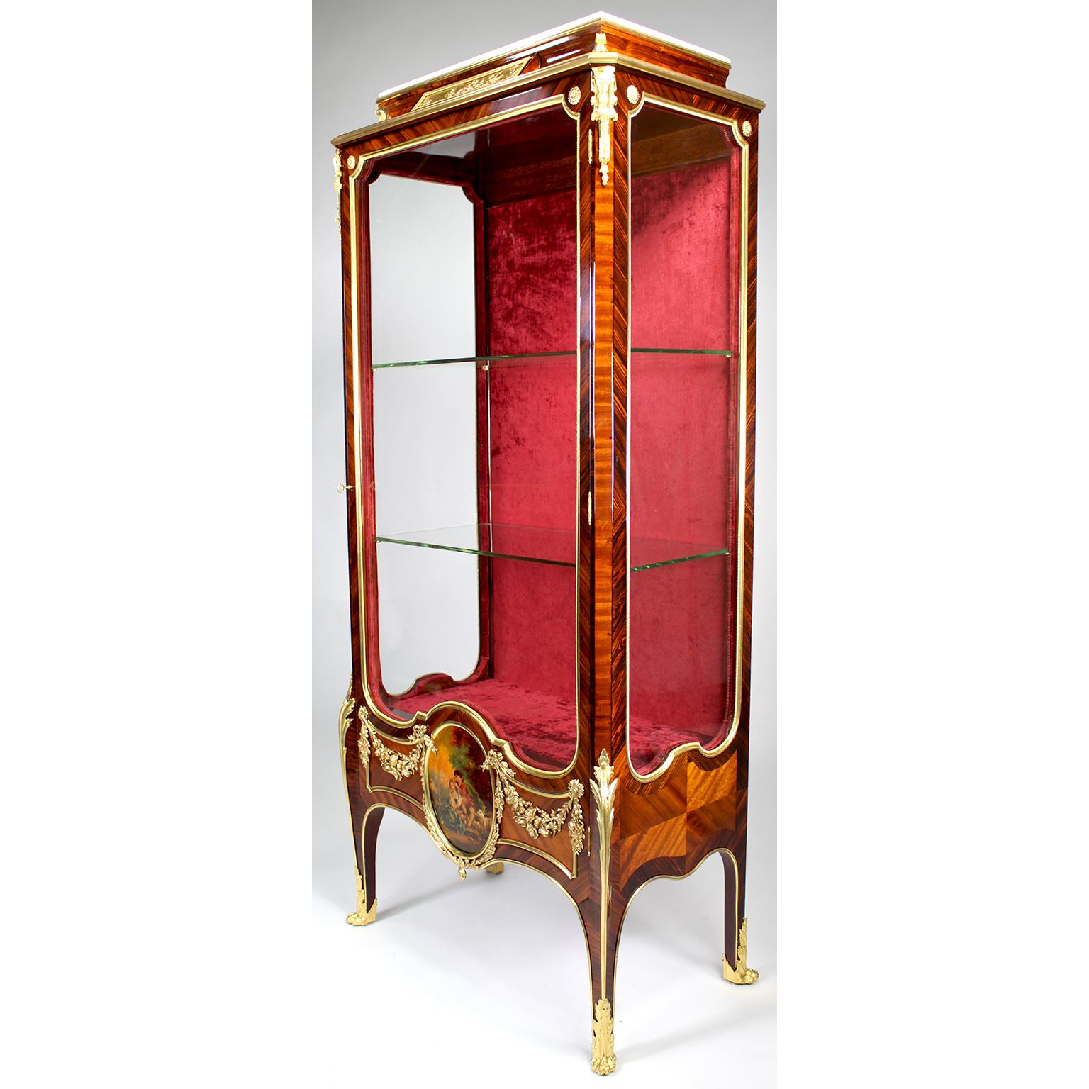 A very fine French 19th century Louis XV style Ormolu Mounted Kingwood, Satinwood and Vernis Martin Decorated Single-Door Vitrine, probably by François Linke (1855-1946). The white marble top structure centered with an allegorical gilt-bronze plaque