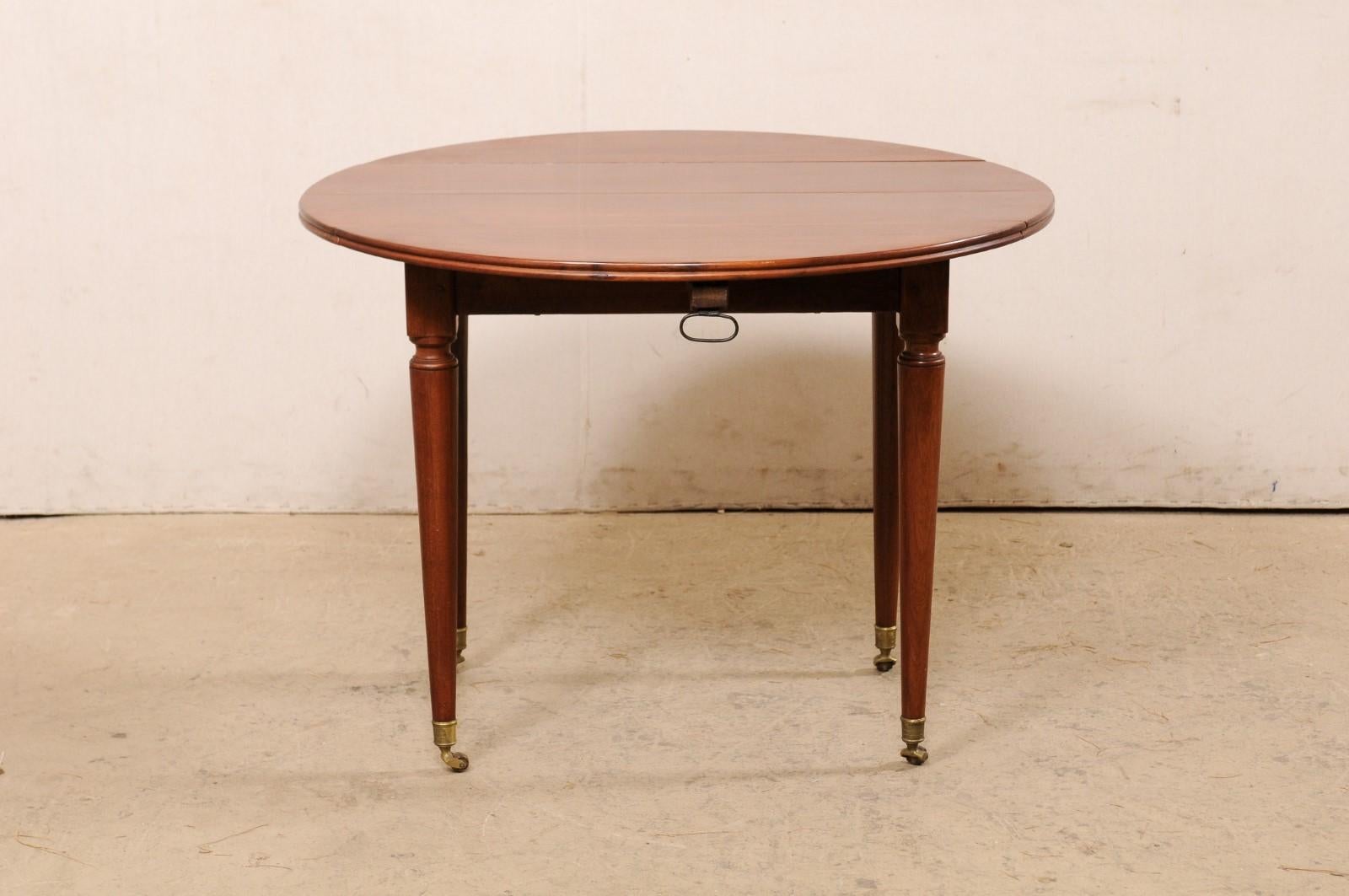 French 19th C. Mahogany Round Table W/Drop Leaves & Petite Brass Caster Feet For Sale 4