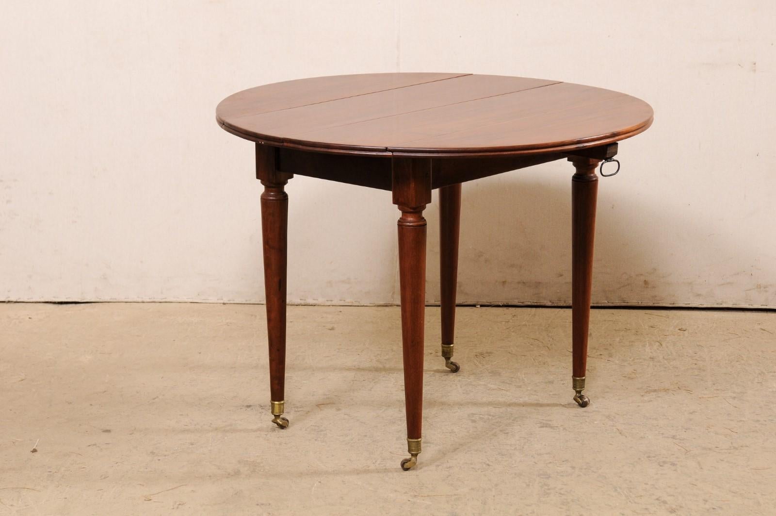 French 19th C. Mahogany Round Table W/Drop Leaves & Petite Brass Caster Feet For Sale 5