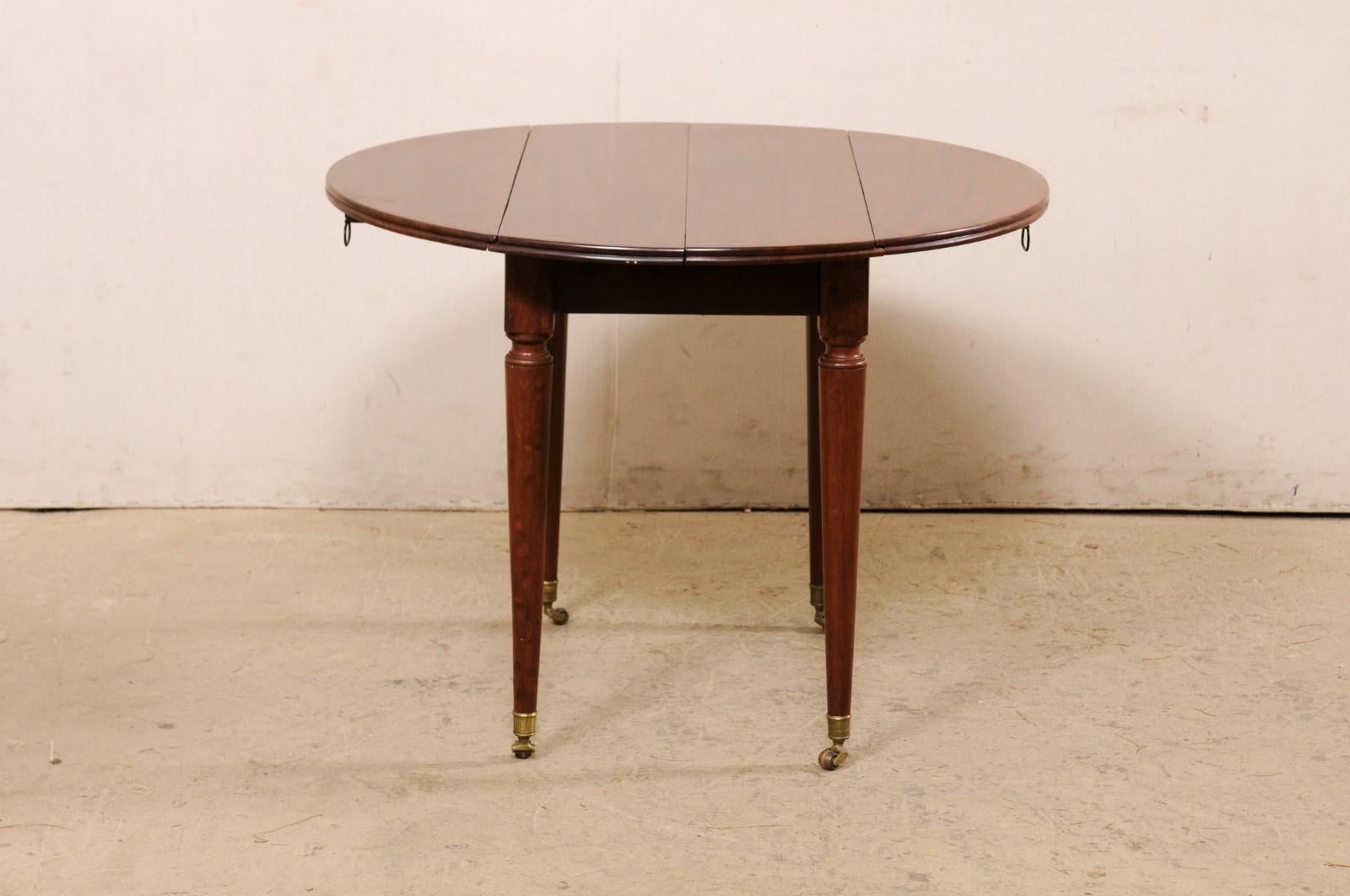 French 19th C. Mahogany Round Table W/Drop Leaves & Petite Brass Caster Feet For Sale 6