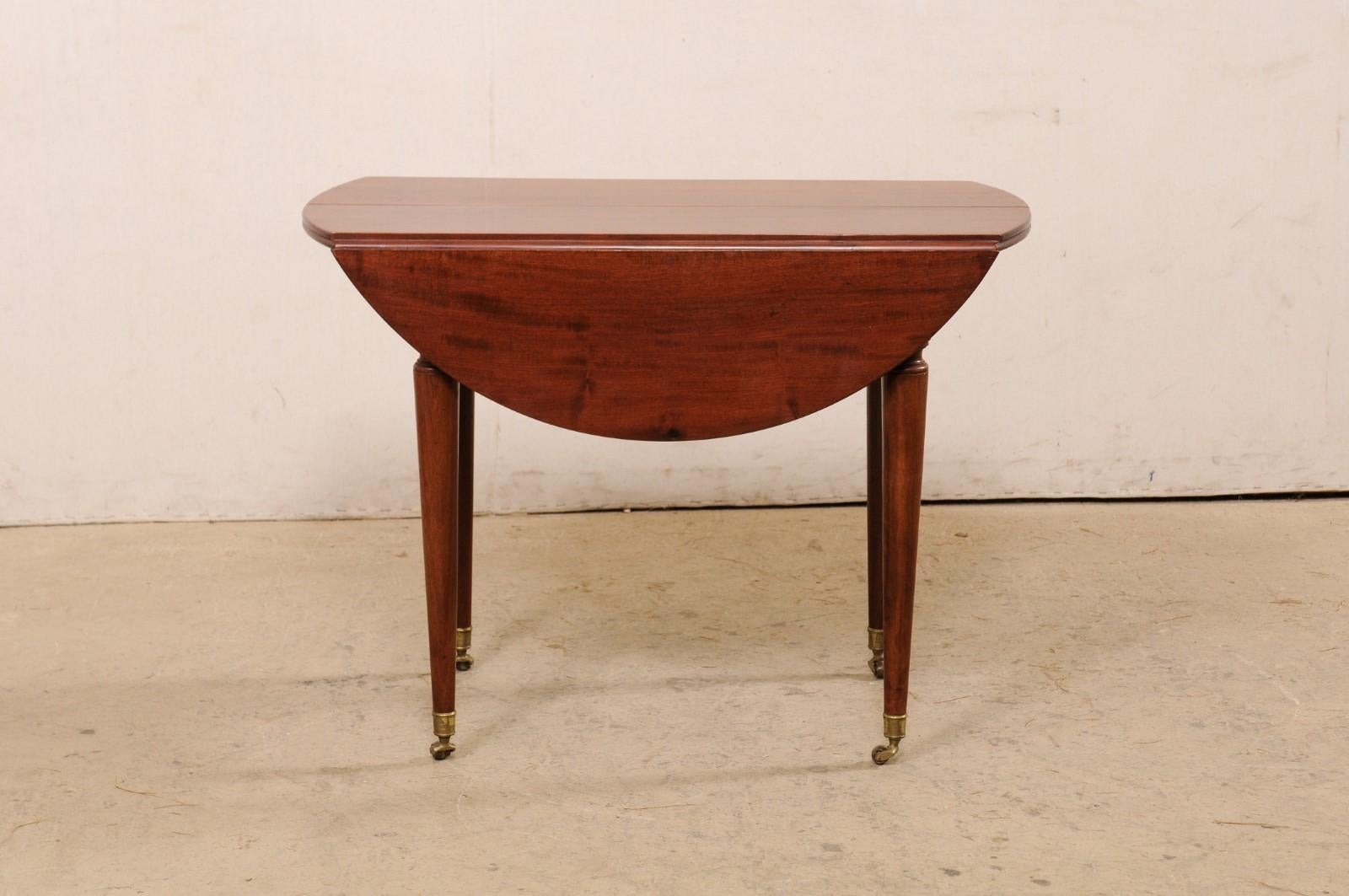 European French 19th C. Mahogany Round Table W/Drop Leaves & Petite Brass Caster Feet For Sale