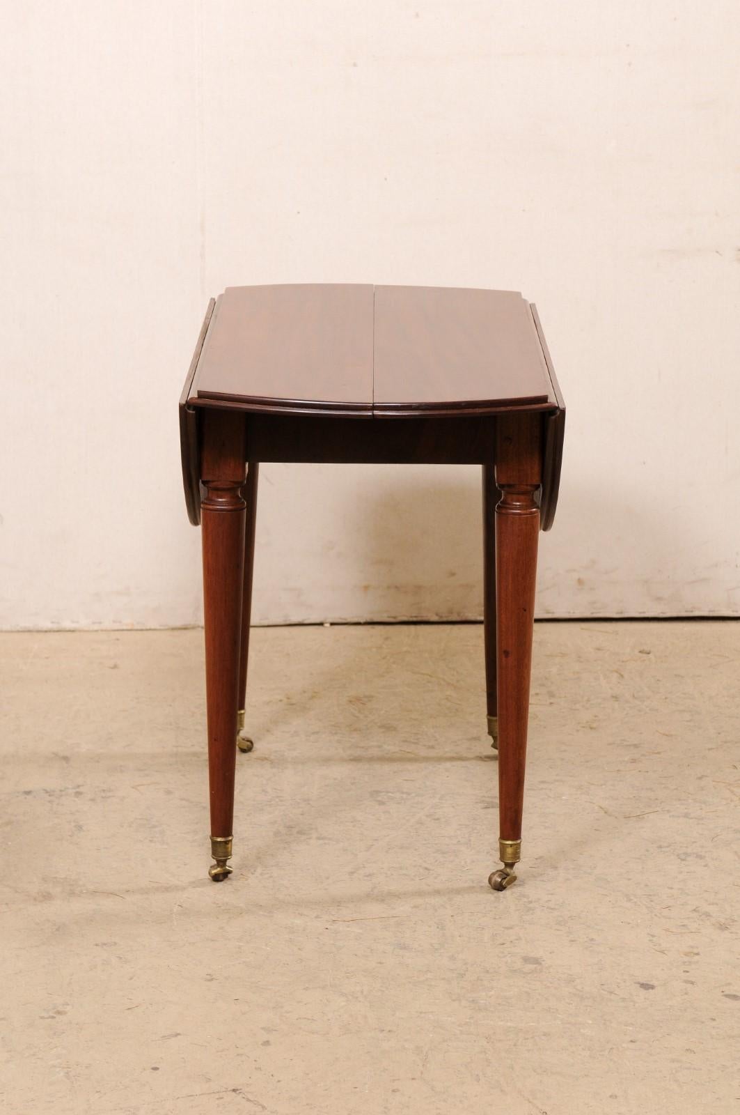 19th Century French 19th C. Mahogany Round Table W/Drop Leaves & Petite Brass Caster Feet For Sale