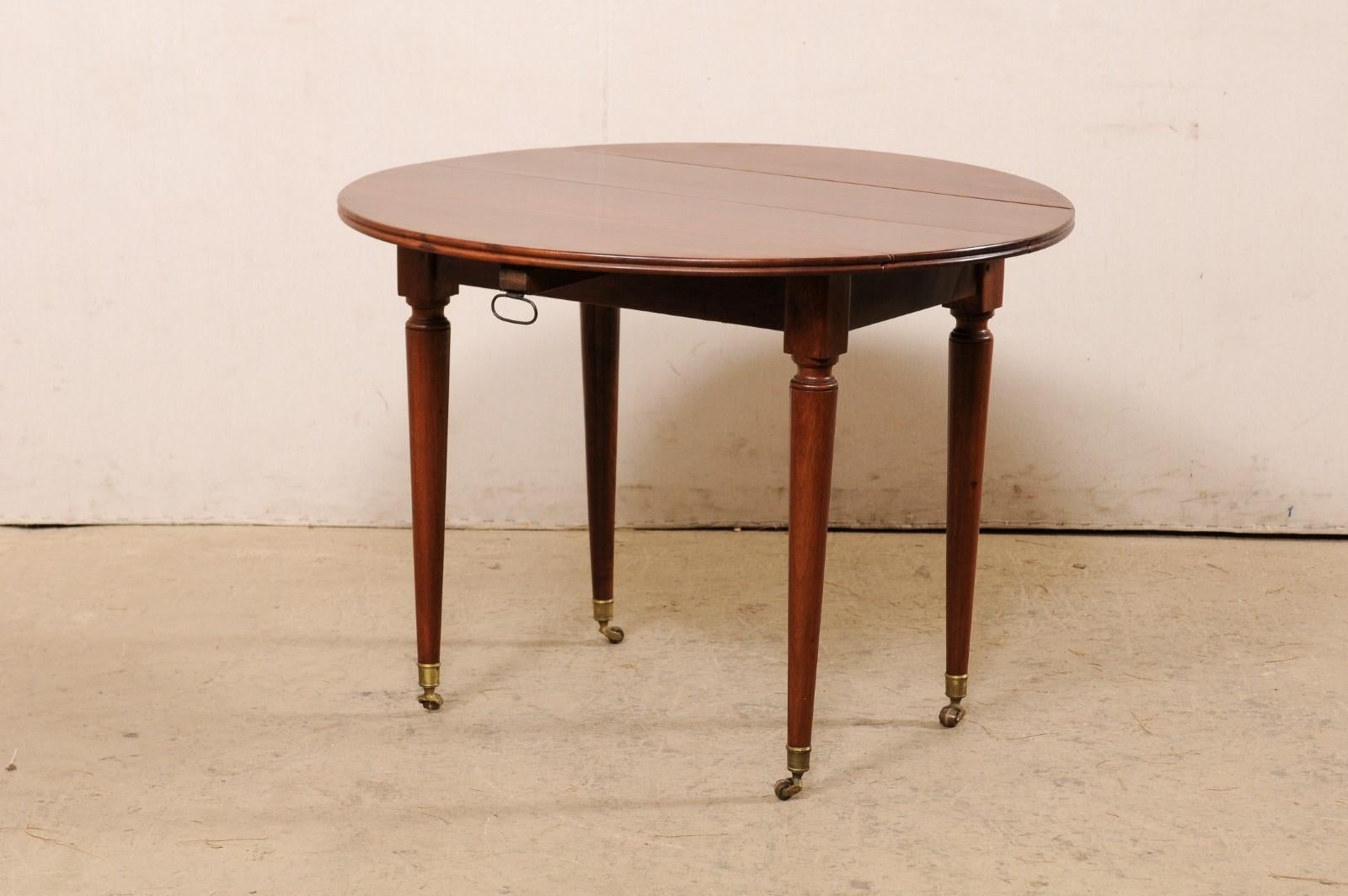 French 19th C. Mahogany Round Table W/Drop Leaves & Petite Brass Caster Feet For Sale 3