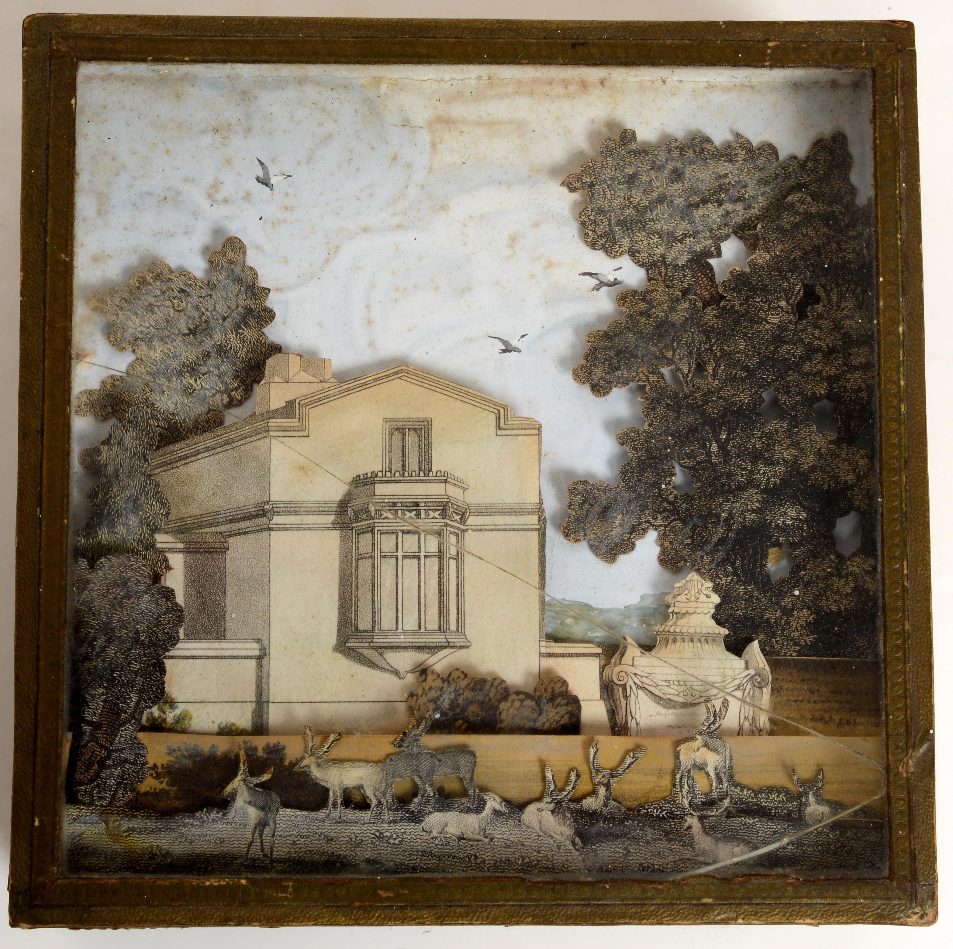 French 19th c Wood and Paper Covered Painted Box With A Neoclassical, Palladian Style, Building Diorama Under the Glass Top. The 3D scene is of a Classical building with wild game in the front, a classical urn and cut out foliage heightened with