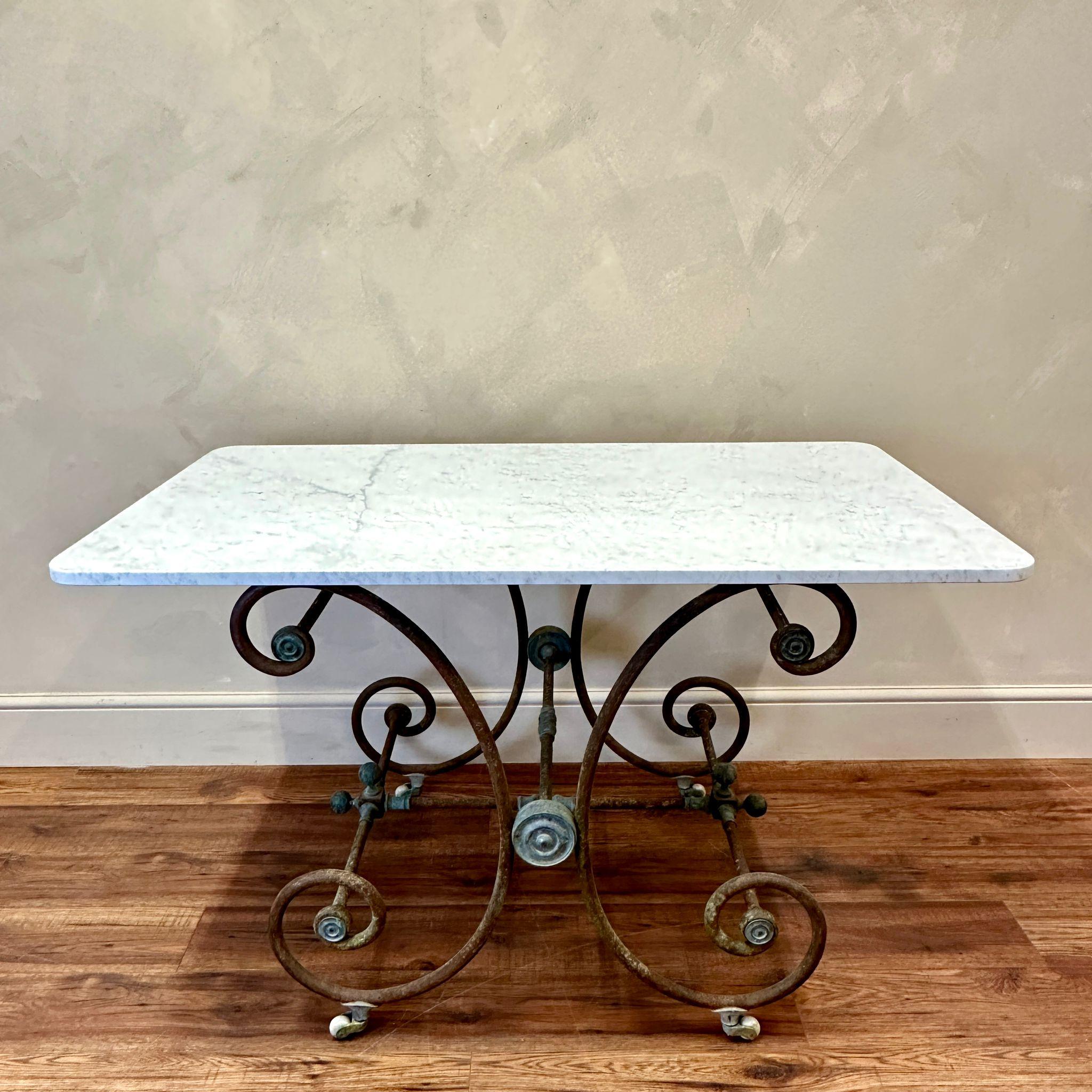 Pâtisserie / Boucherie tables were traditionally used in the1800’s, in Parisian Bakery/Butcher's  windows, to display their finest cakes/cuts of meat and other delicacies.
This example has wonderful original colouration, sitting on ceramic wheels it