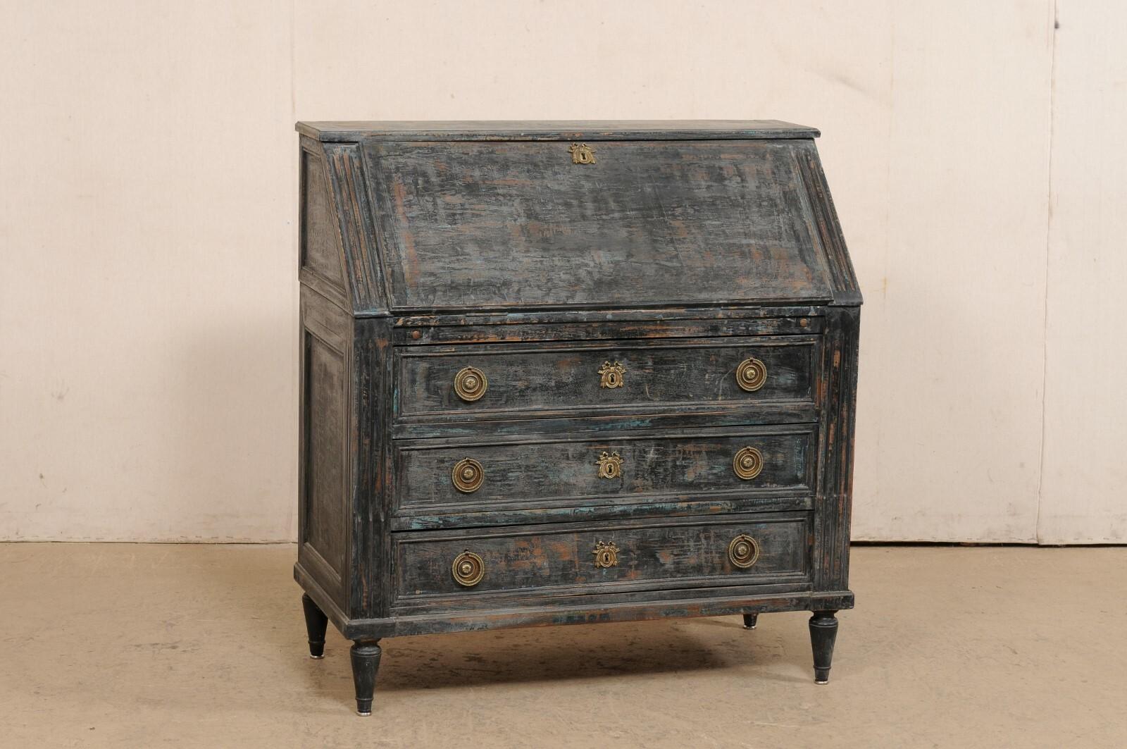 A French painted wood secretary chest from the 19th century. This antique slat front chest from France features a drop down/fall front door, which opens to a desk-top surface (complete with leather writing pad) and reveals interior shelving and