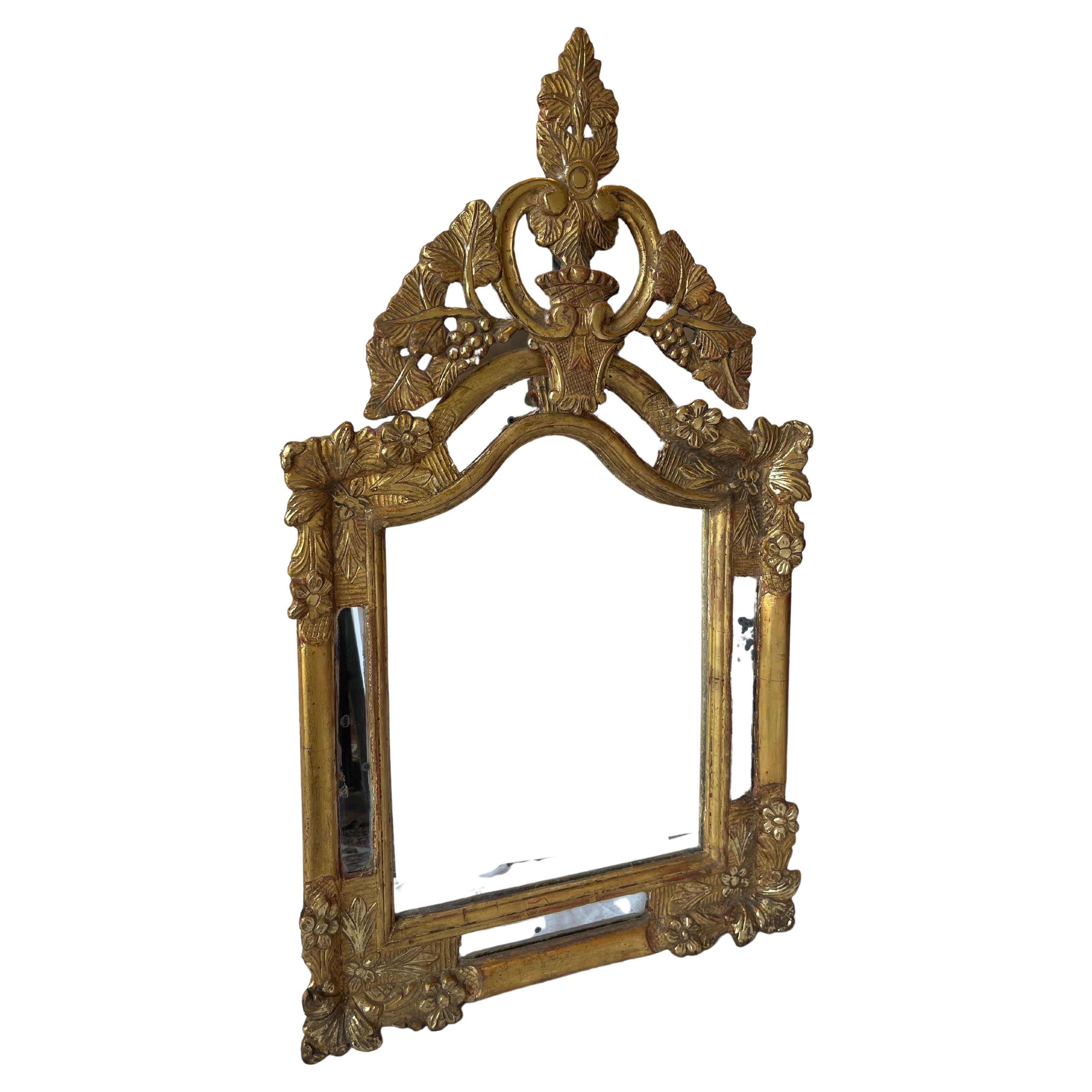 Golden wood mirror 19th cent. Hand carved. Fruits and flowers.
Probably mounted with antique and original parts. Antique mirror on both side.
The back has been changed.
 