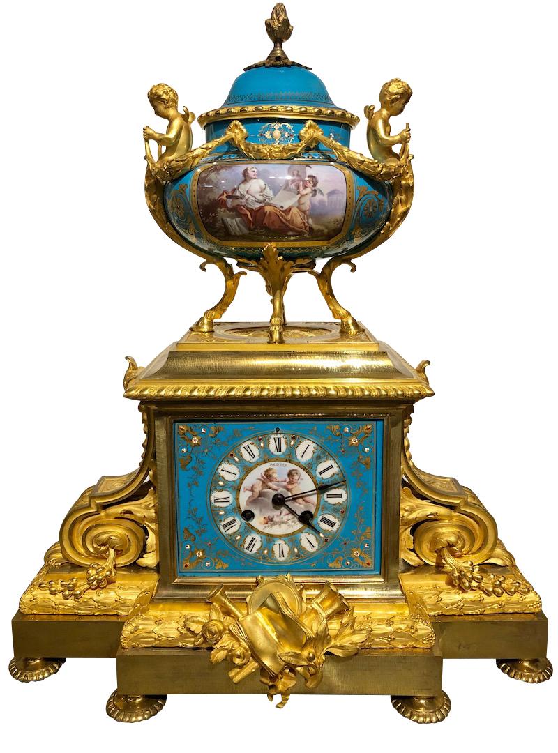 French Ormolu and Sevres style porcelain jeweled three-piece clock garniture and 5-branch candelabras by Henri Picard
France, circa 1870
Dimensions of Clock: Height 20.5