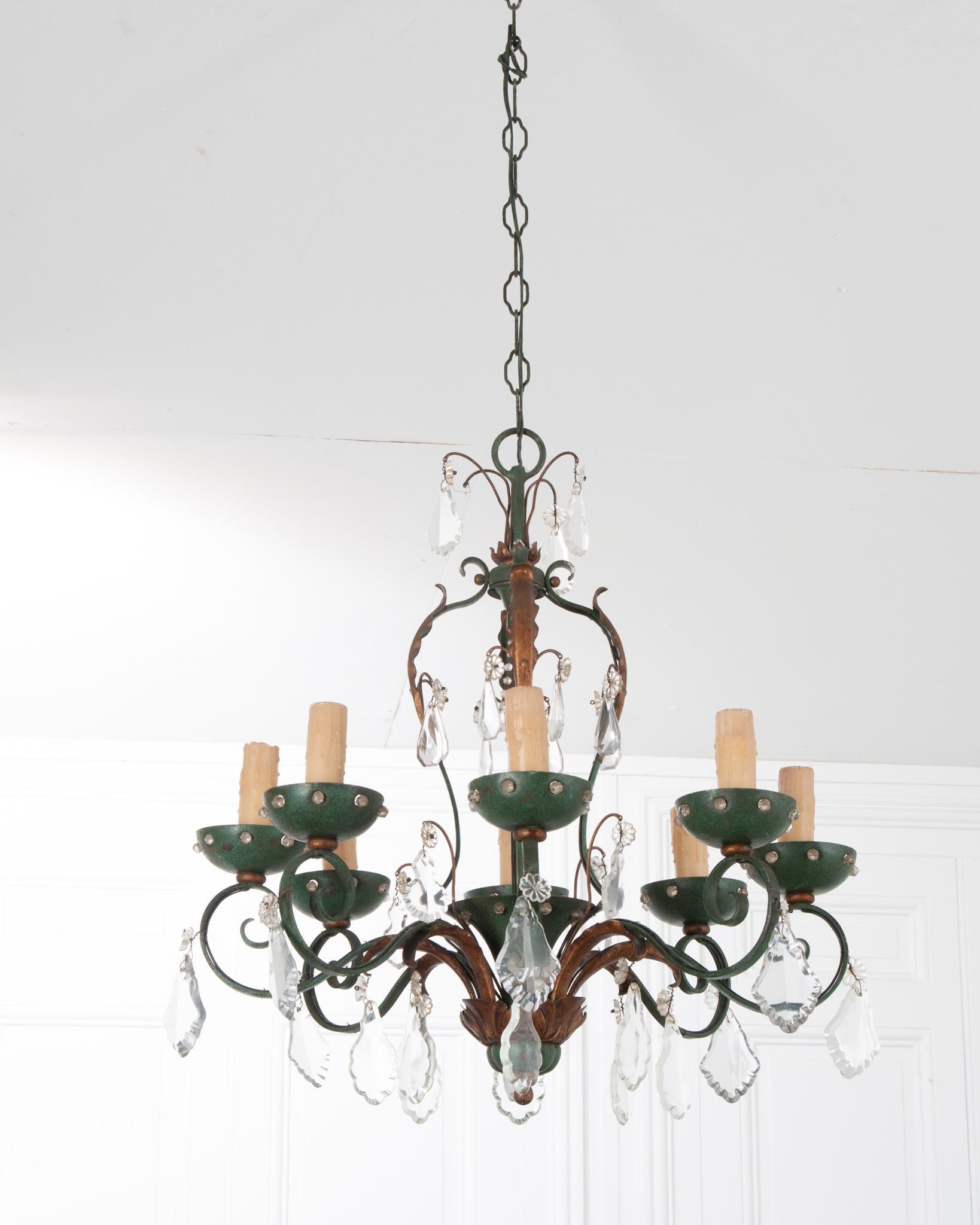 An eye-catching eight light chandelier from 19th century France! A combination of blueish-green and gilt metal has patinated beautifully over the years. Decorative leaves in gold gilt are featured on each arm of the chandelier. Gorgeous pieces of