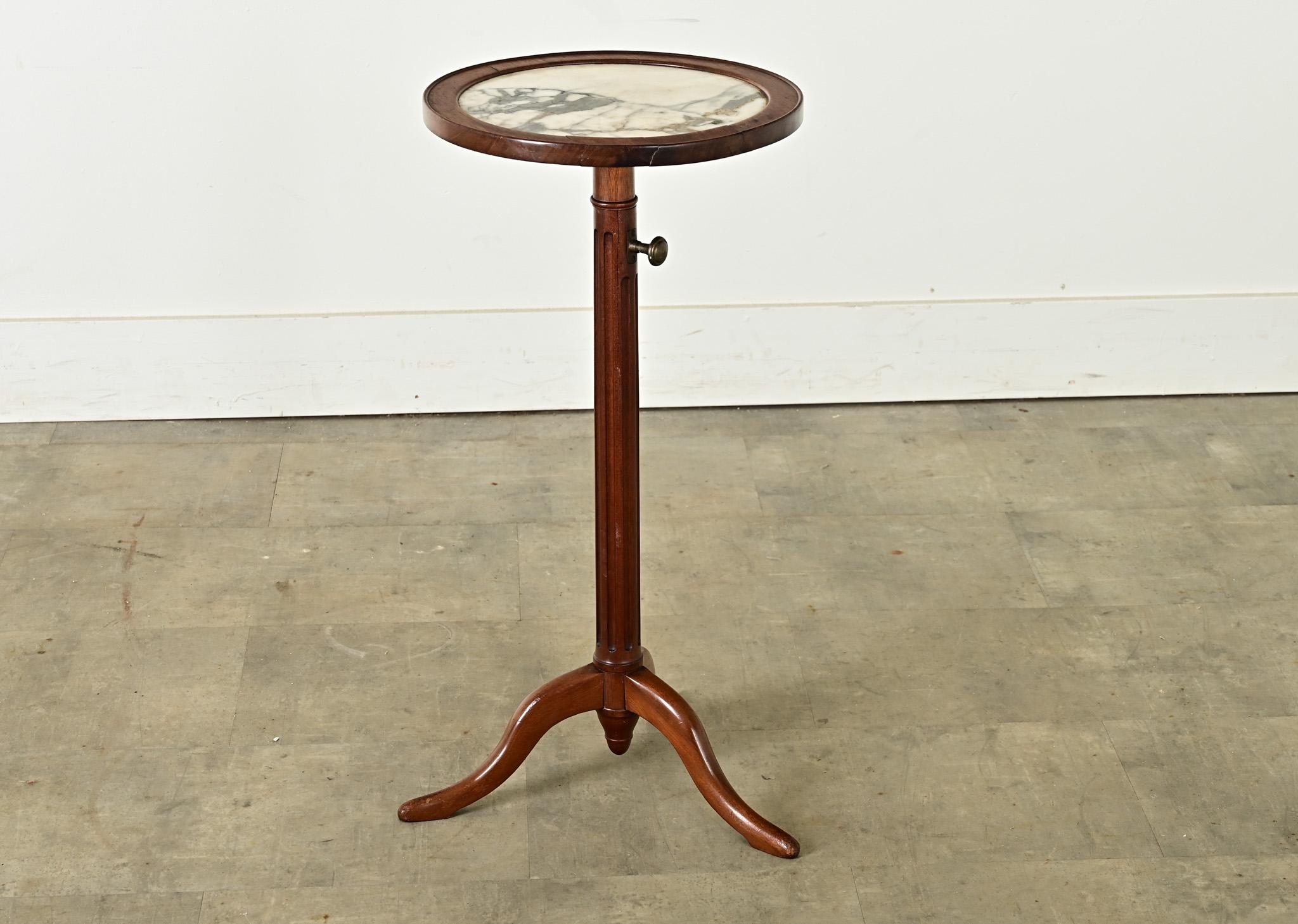 A clever little side table, this 19th century French gueridon in marble and mahogany is adjustable in height to suit any room or seating arrangement. It’s a fantastic size to place between two arm chairs or use like a plant stand. Pulling out the