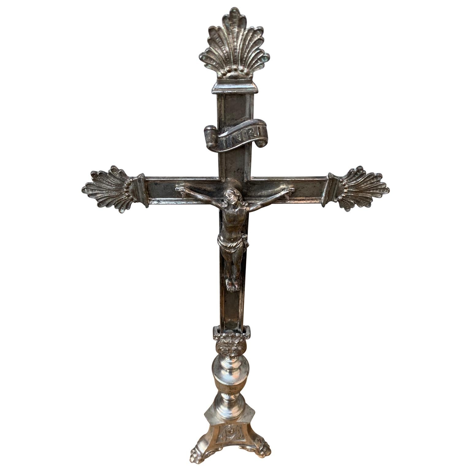 A 19th Century silver plated French alter crucifix. Above Jesus' head, there is a plaque reading 