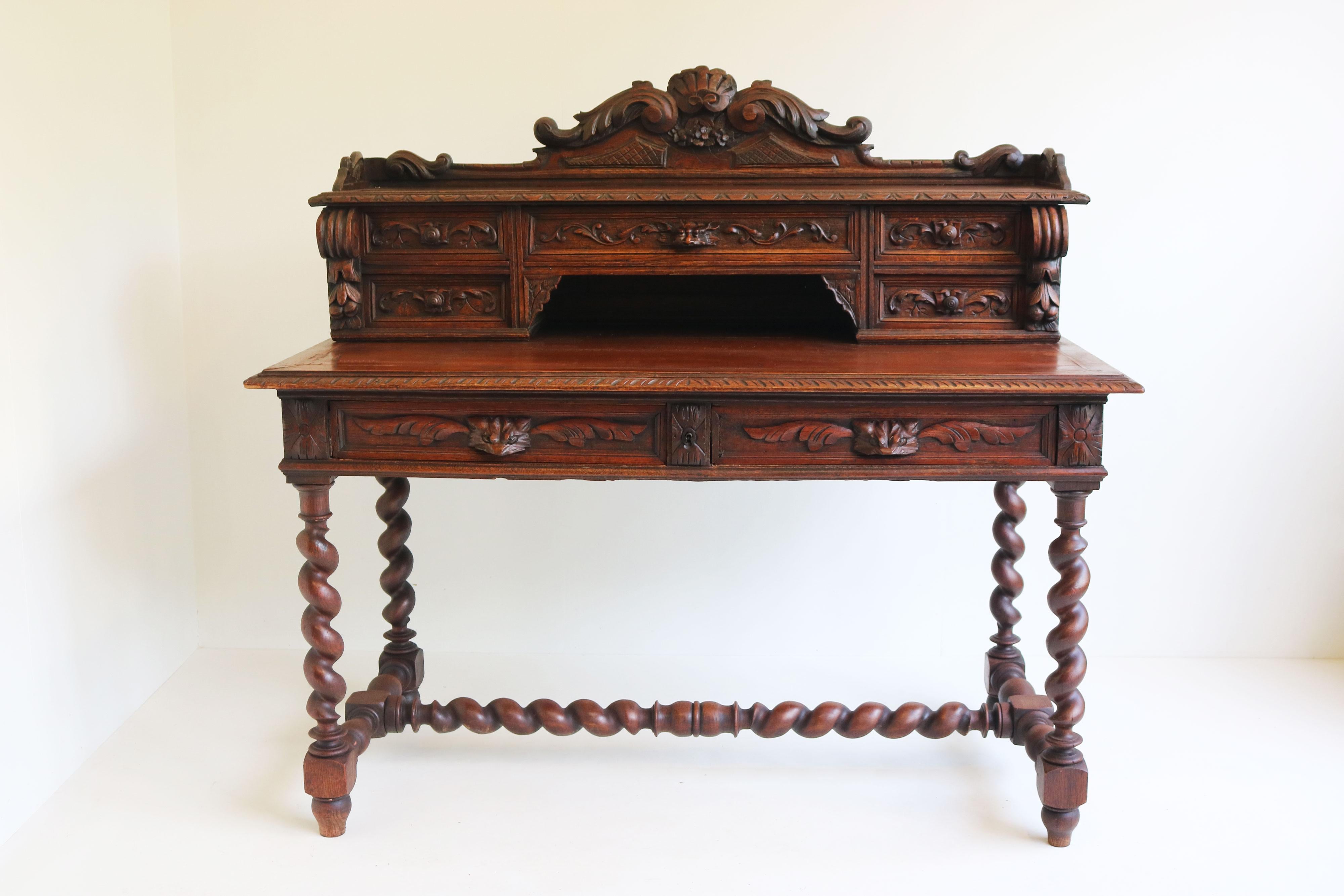 Gorgeous French antique 19th century Renaissance revival / Hunt style Writing desk in carved oak. 
Marvelous decorated hunt style desk with fox head drawers & barley twisted columns. 
Made with superb craftsmanship from European Oak. The top has 5