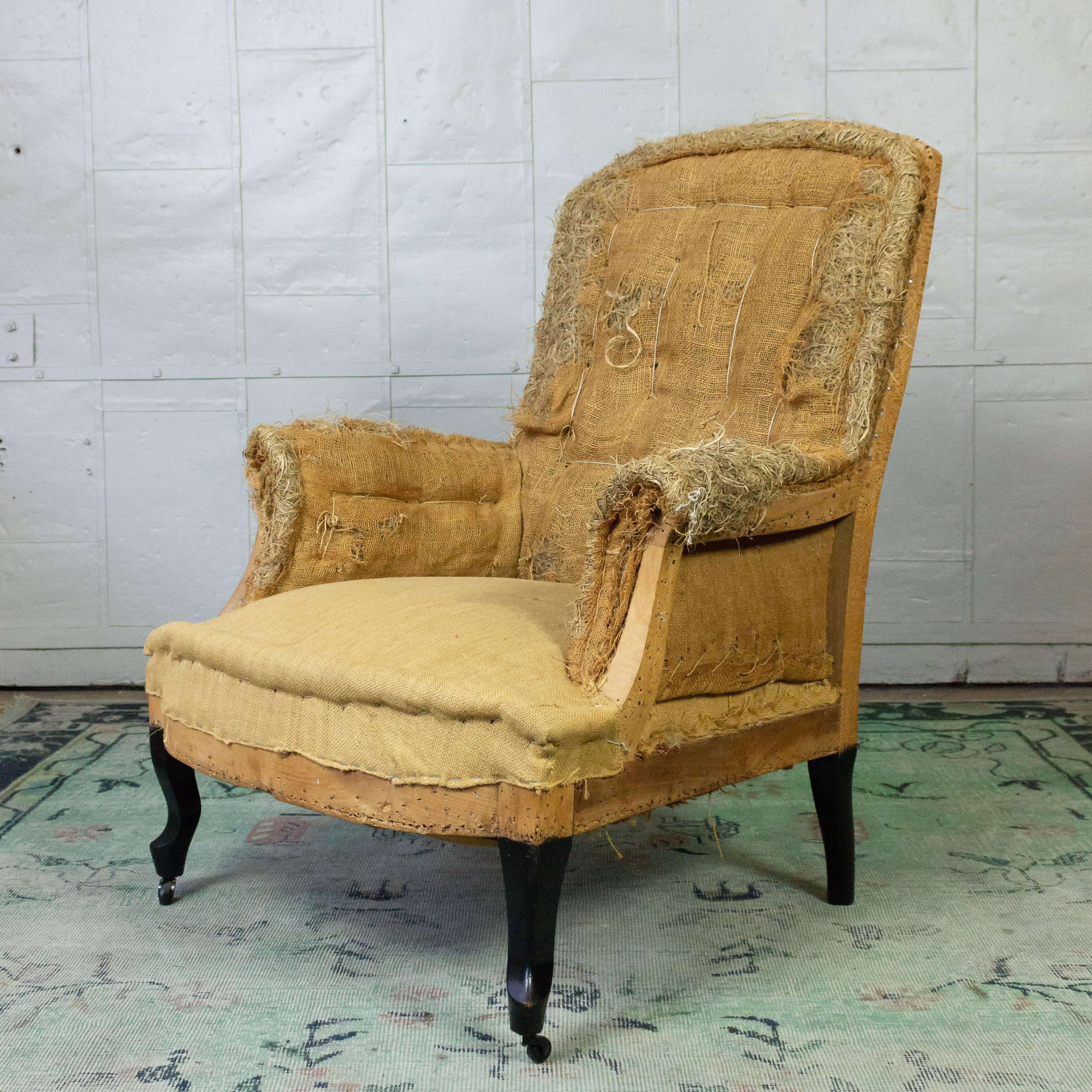 French 19th century armchair with ebonized cabriole legs, stripped down to the original muslin and burlap. Ready to be upholstered.

Ref #: SN0512-09

Dimensions: 39