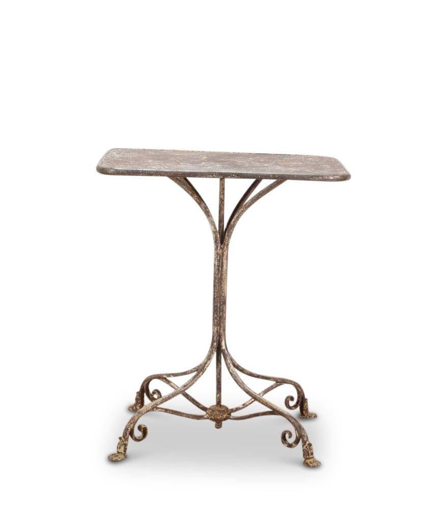 French 19th Century iron garden table.

With original time-worn white paint and wonderful patina. 

An elegant base with four sections leading down to pawed feet.

Made in the Northern French town of Arras.