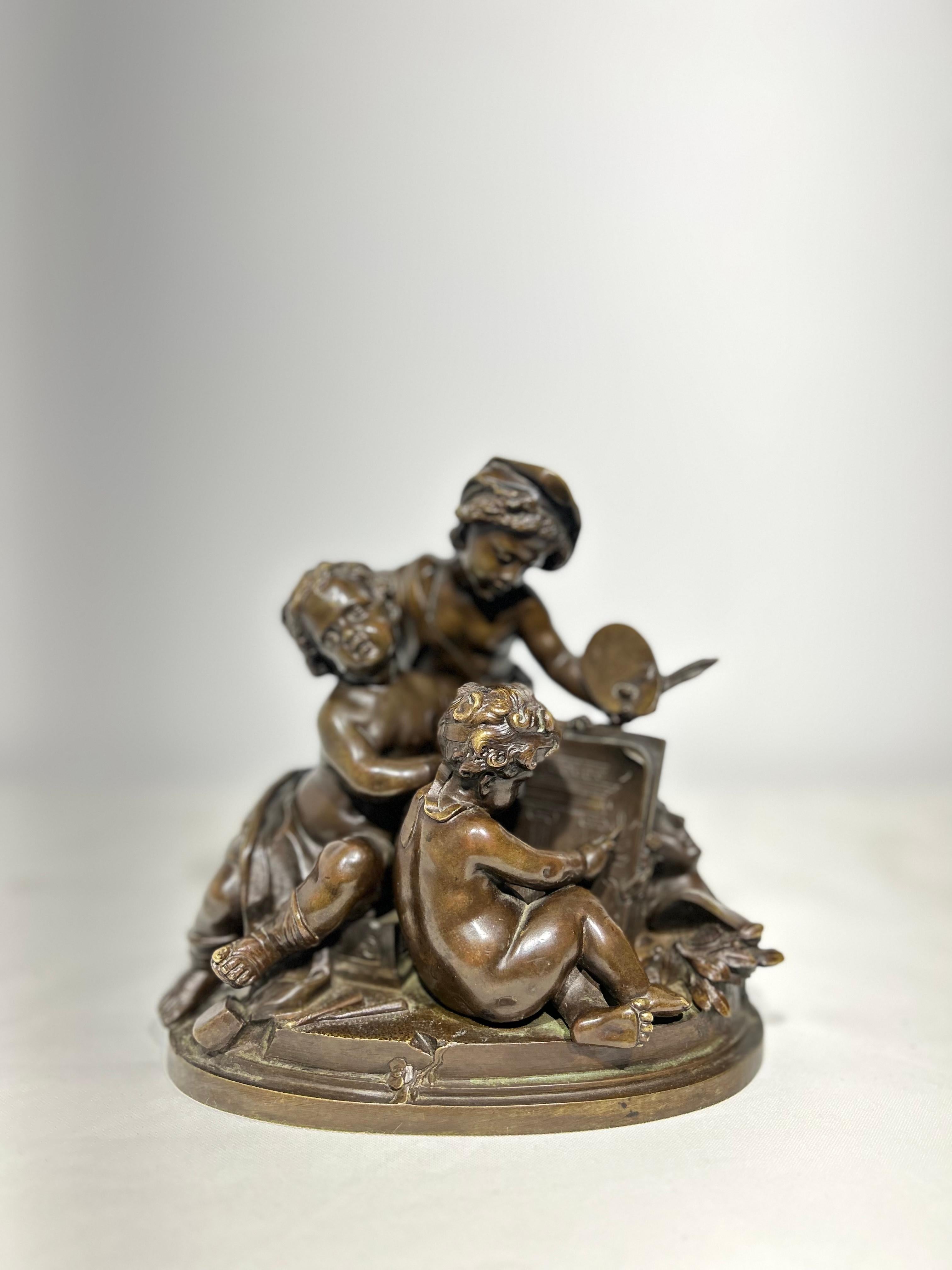 A beautifully refined bronze statue depicting an art scholar teaching two young cherubs. It has been finished with a patina for developing glossy sheen with age. Mounted on an oval bronzed base.