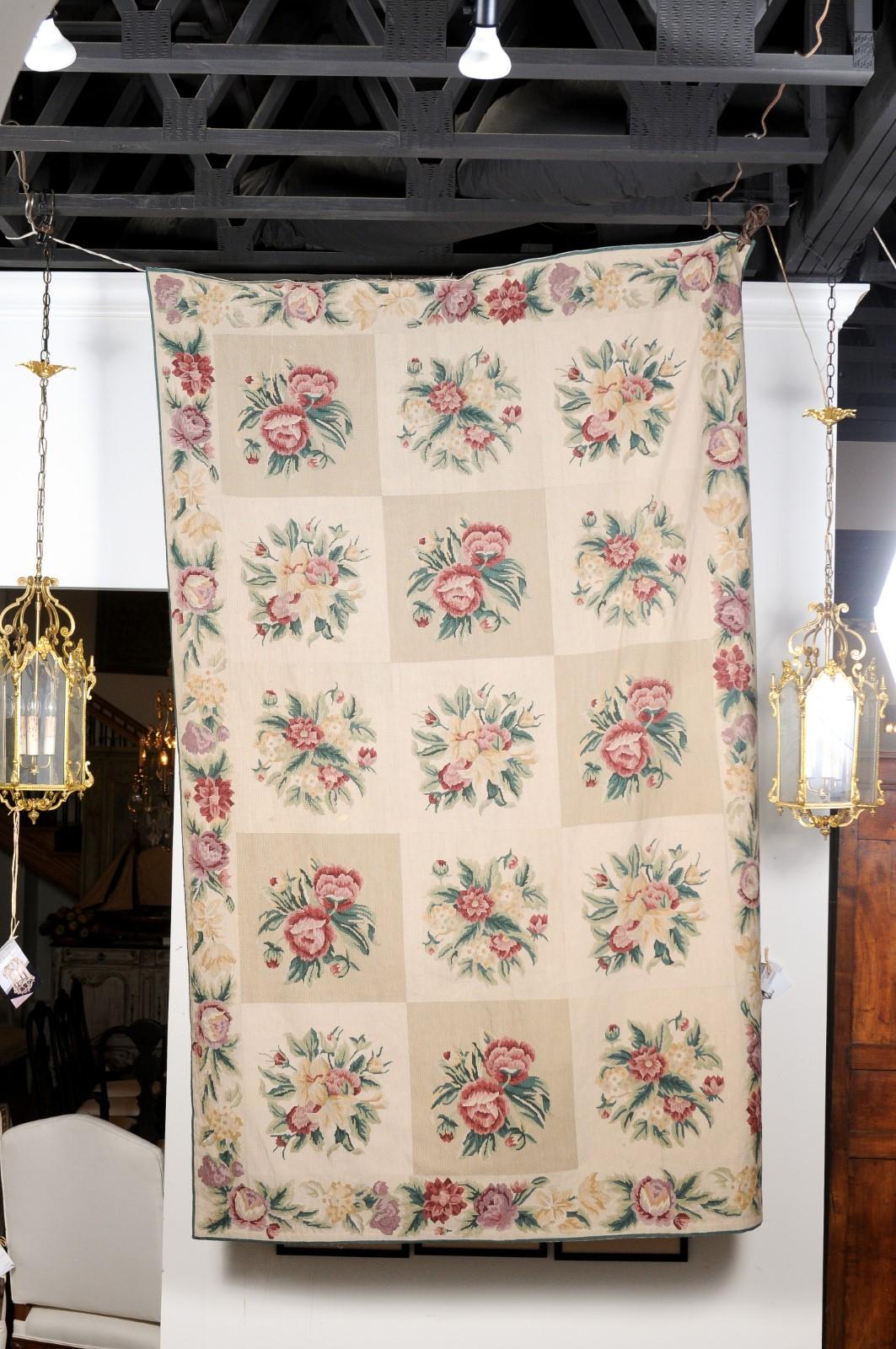 A French Aubusson wall tapestry from the 19th century, with pink and cream floral décor. Created during the 19th century in the Aubusson manufacture located in central France, this wall tapestry features a perfectly organized décor showcasing