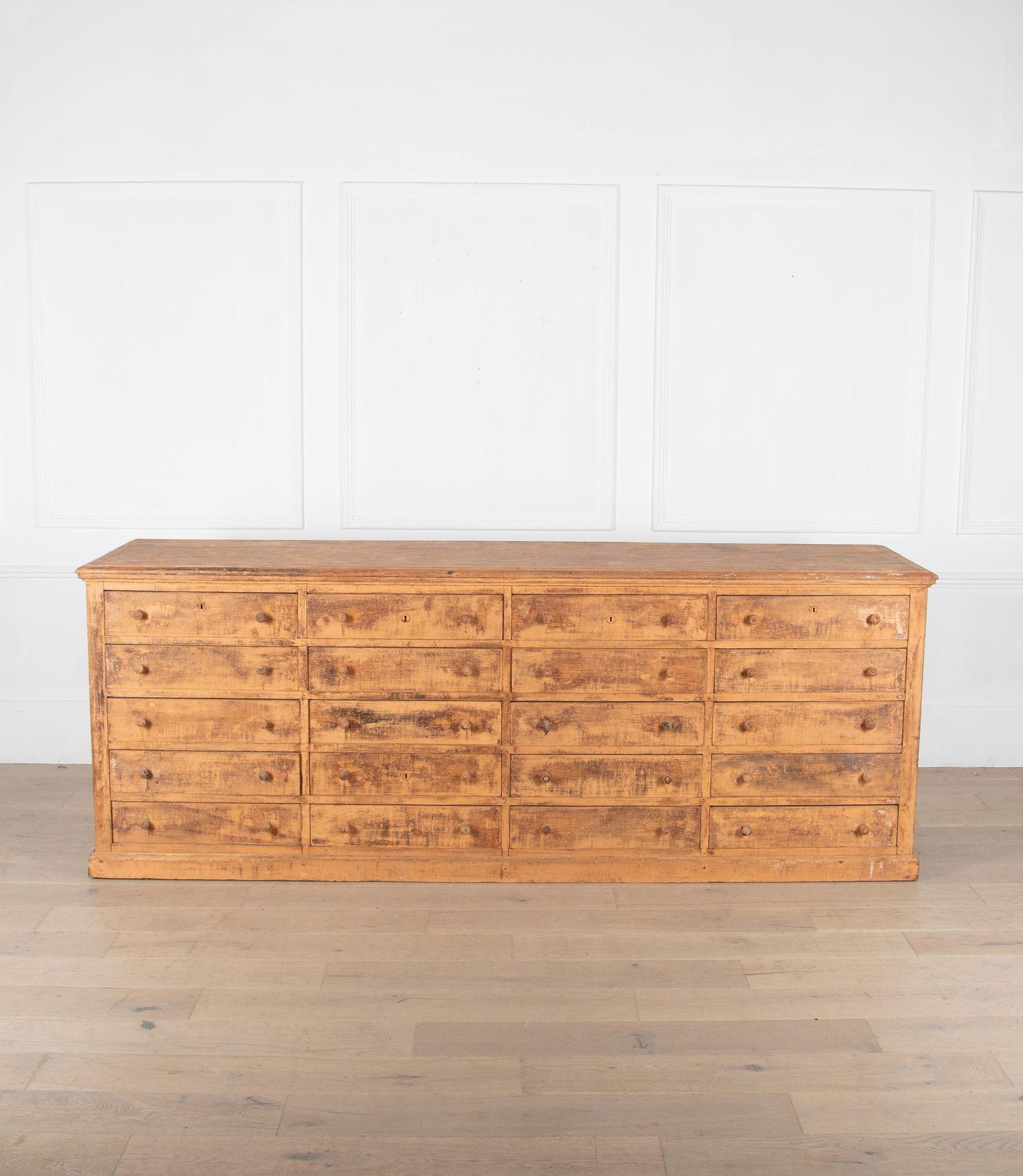 19th Century bank of drawers from a French hardware store.
Pine construction with layers of original paint. With a shrinkage crack on the top of the piece.
Circa 1880.