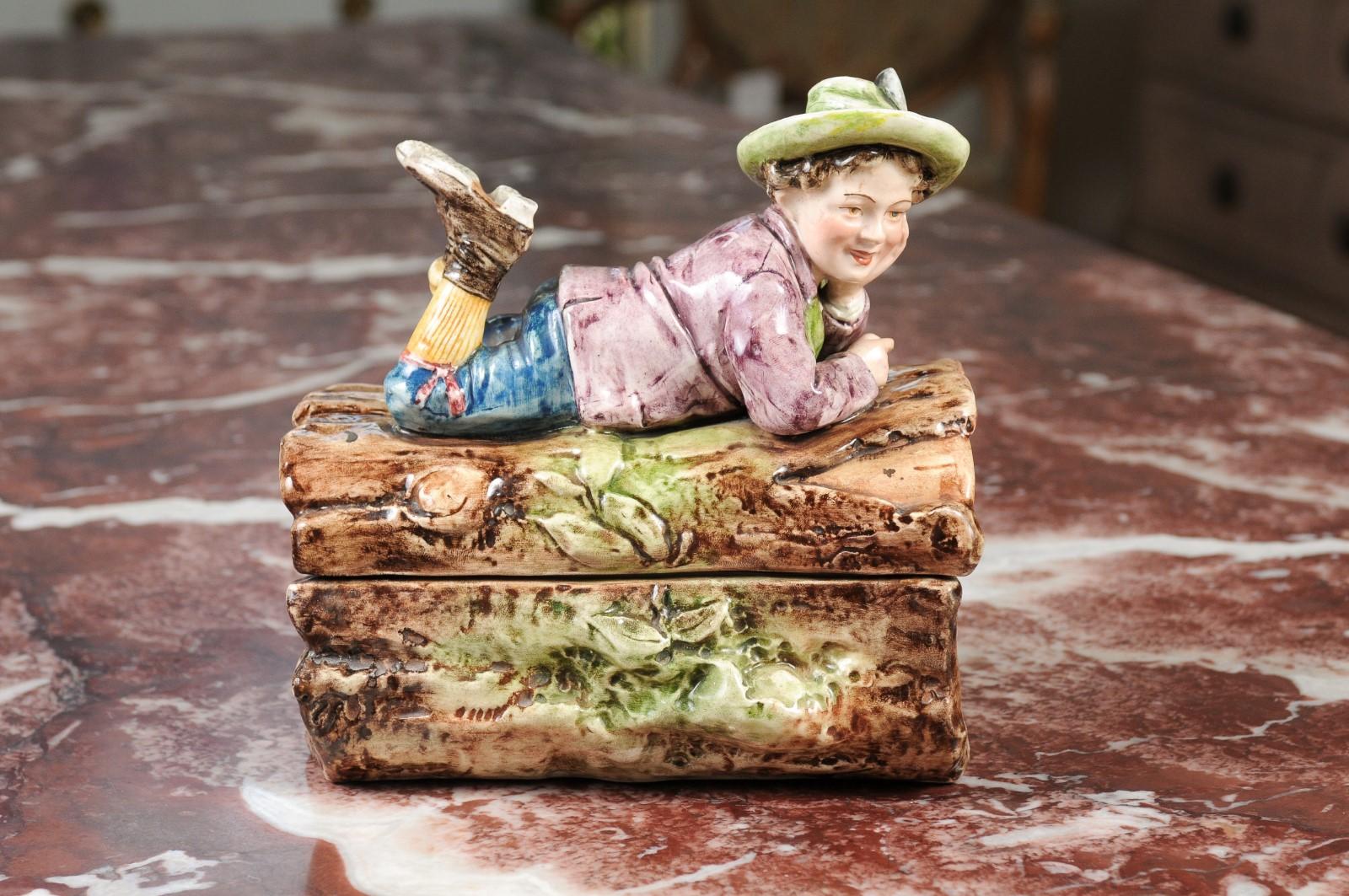 French 19th Century Barbotine Bonbon Box Depicting a Boy Laying on a Tree Trunk For Sale 1