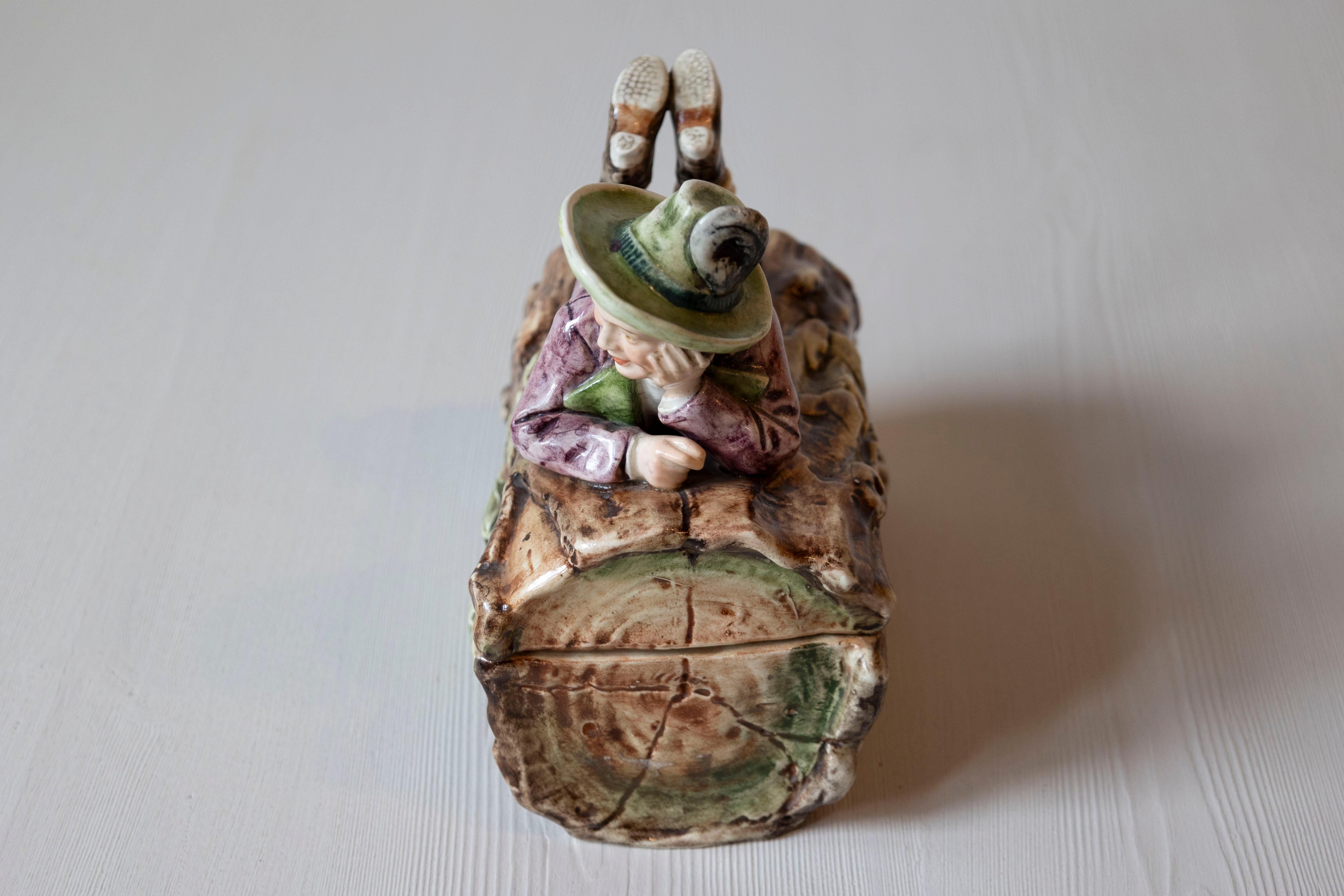 French 19th Century Barbotine Bonbon Box Depicting a Boy Laying on a Tree Trunk For Sale 1