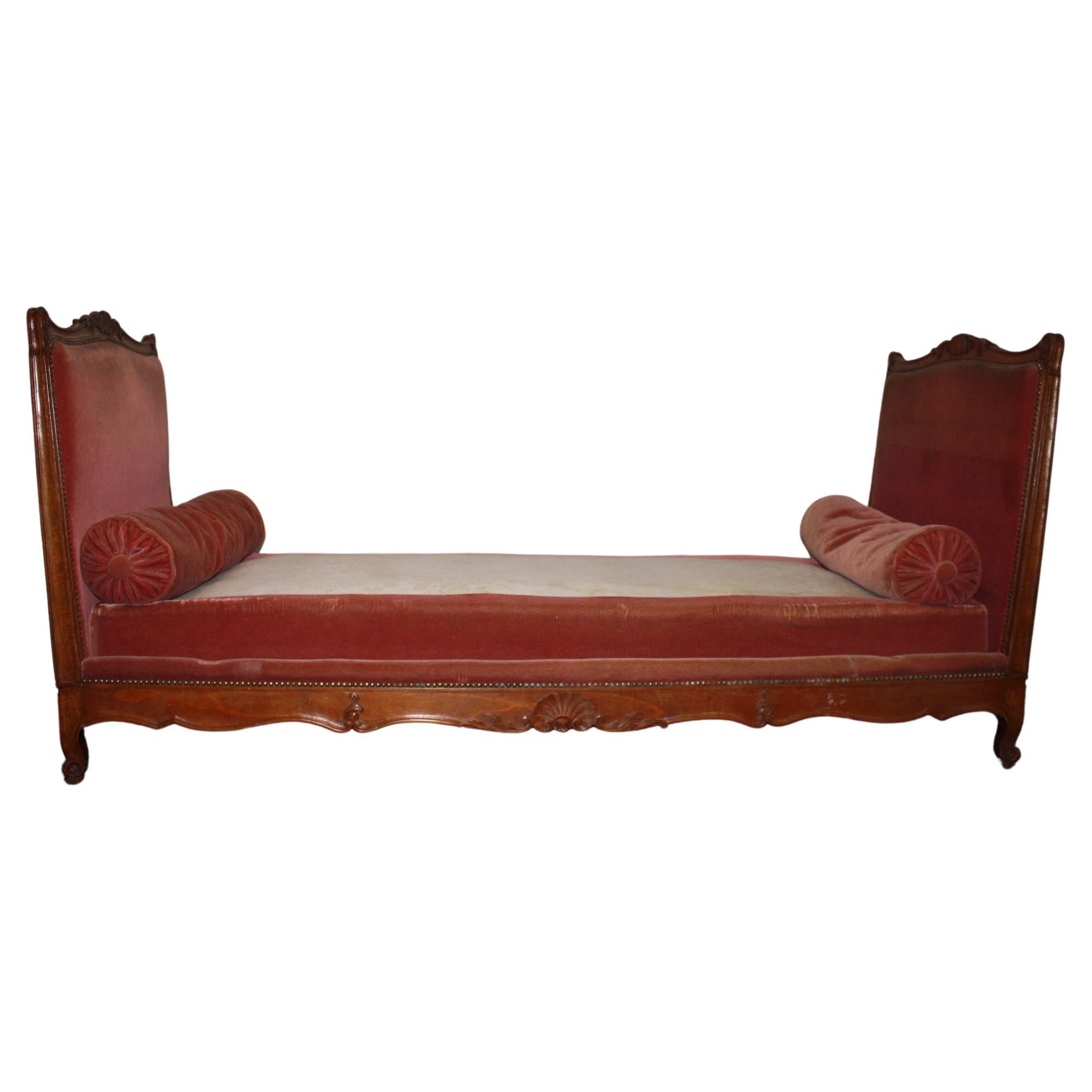 This Daybed is nicely carved garnished with a red velvet fabric. Easy to place anywhere at home.