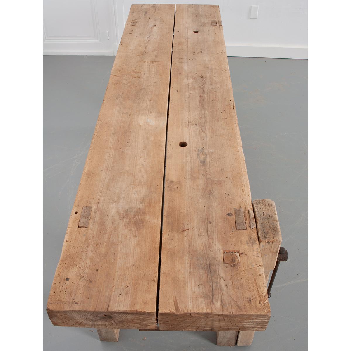 This Artisan’s bench from Burgundy France is made of unfinished beech and iron. Years of use shows on the surfaces of this table and its patina adds such character to this piece. A single drawer with drop-loop pull is offset under the work surface.