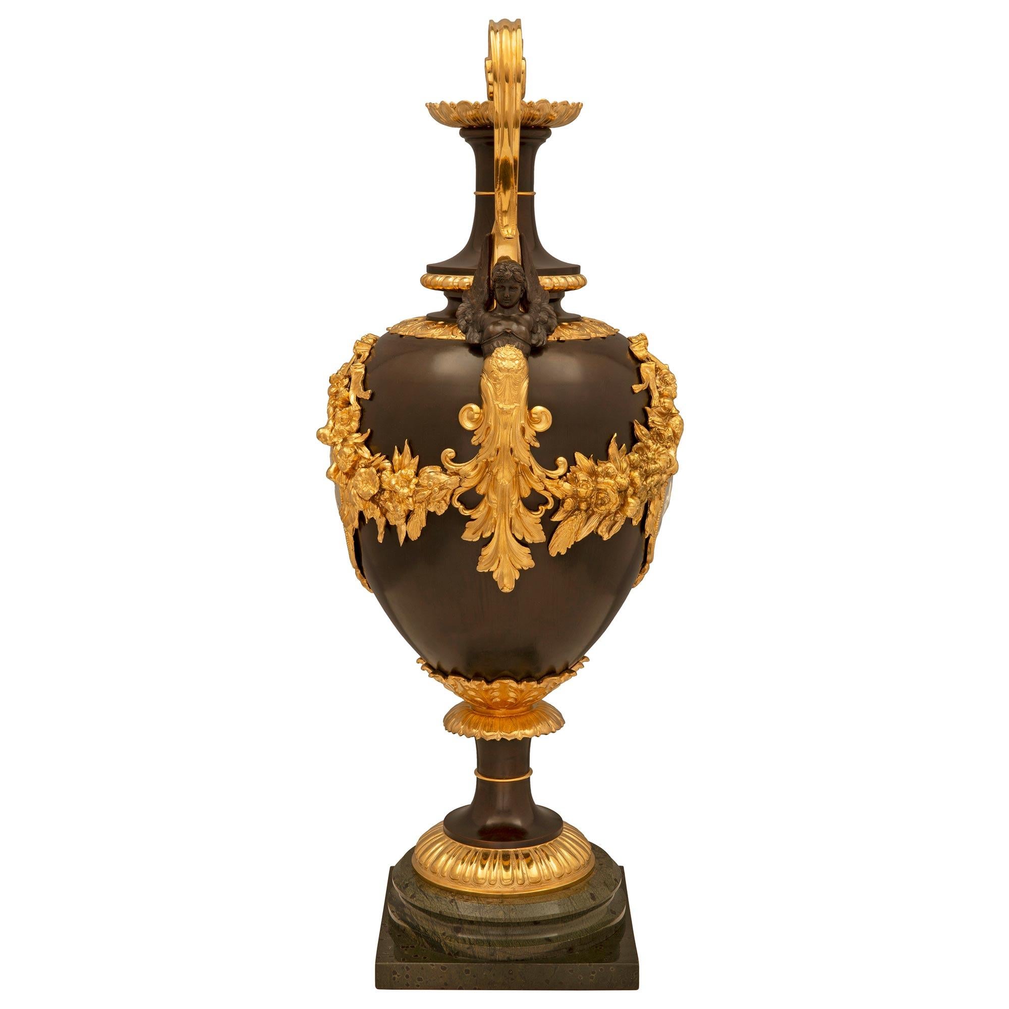 Patinated French, 19th Century, Belle Époque Period Bronze and Ormolu Urn For Sale