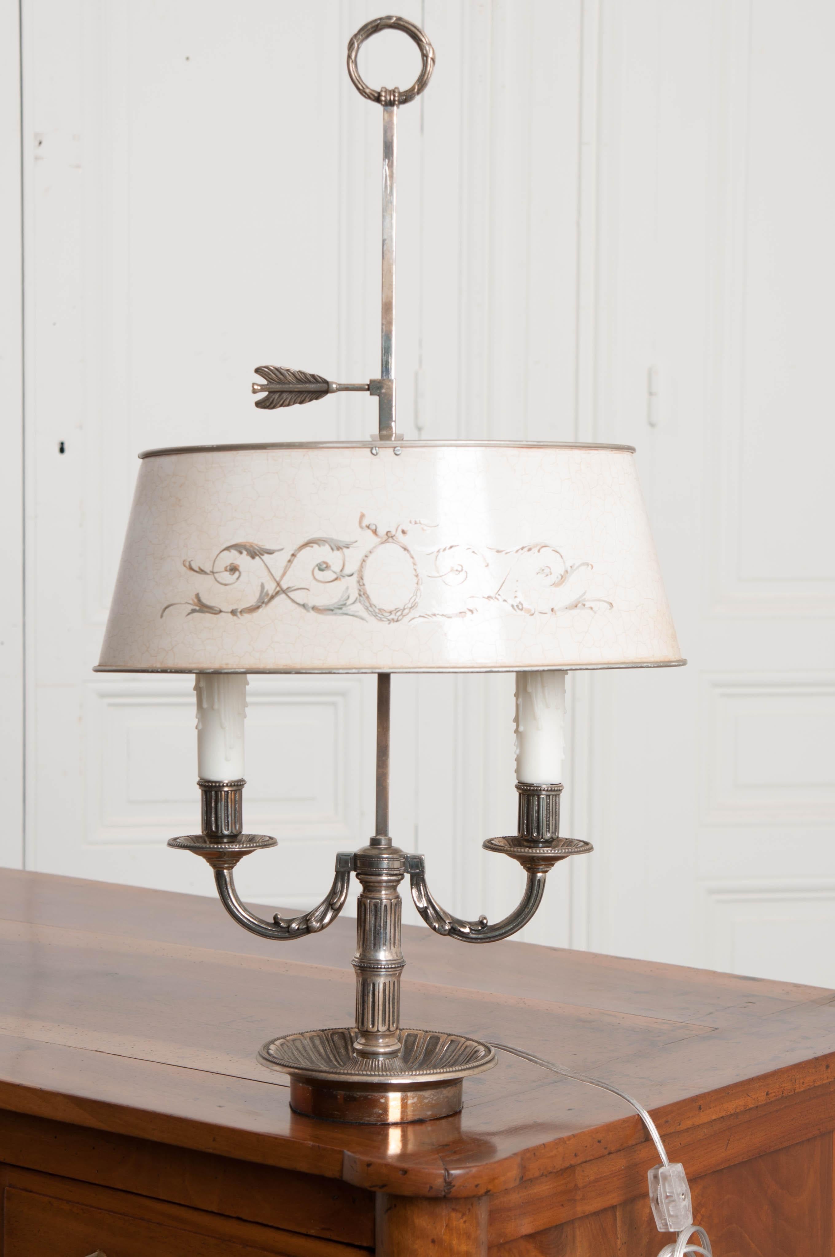 A French 19th century, silver plated, two light Bouillotte lamp. Bouillotte is a card game, similar to poker, that was wildly popular in France during the 18th and 19th centuries. It was so popular that the French developed furniture that is best